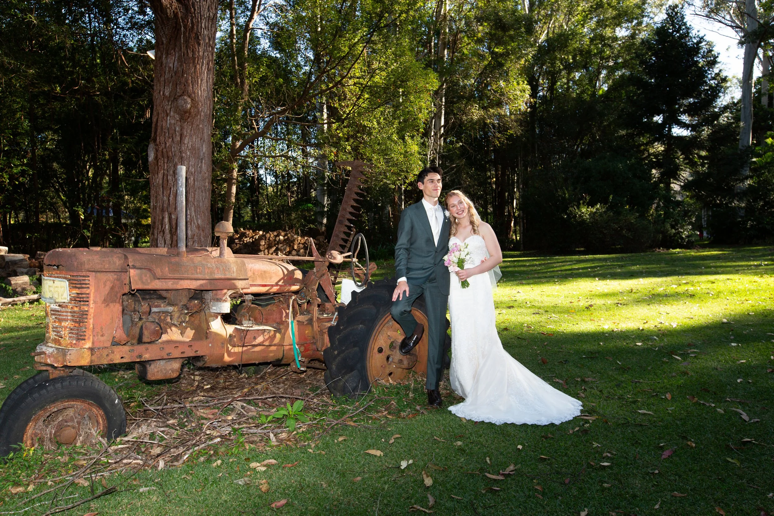 Wedding portraiture is rustic outdoor setting.