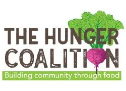 Logo for The Hunger Coalition, featuring a green tree and a purple vegetable, with the tagline 'Building community through food'.
