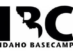 Part of a logo with the words 'IDAHO BASECAMP' and a stylized letter 'B' resembling a mountain or landscape.