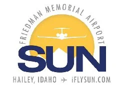 Sun logo with an airplane flying over a yellow sun, text reads Friedman Memorial Airport, Sun, Hailey, Idaho, iFlySun.com