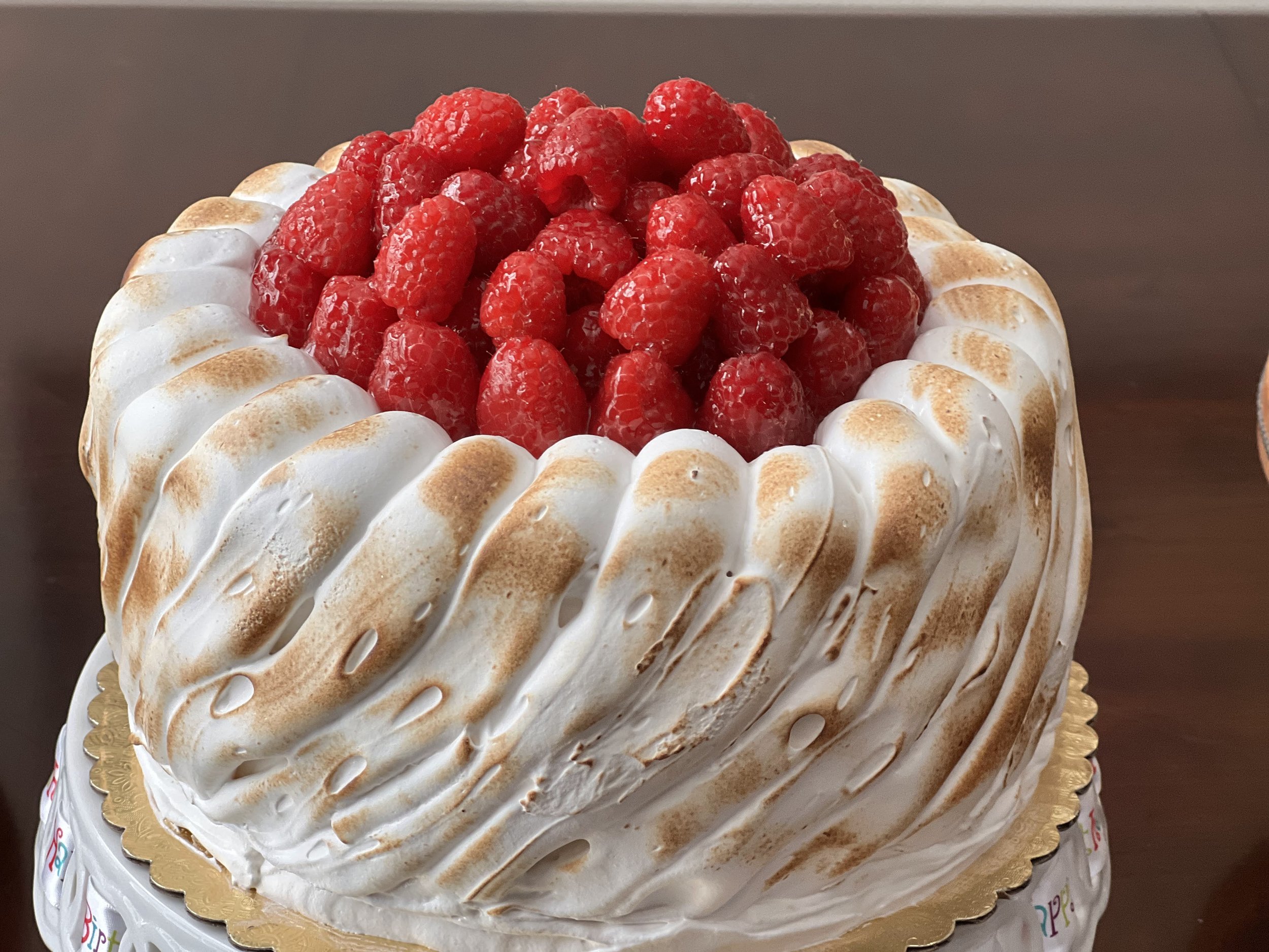 Lemon Cake with Meringue Frosting and raspberries