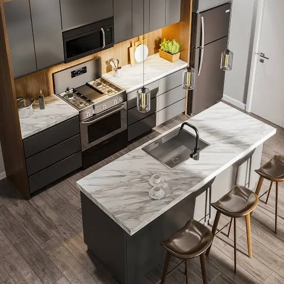 Modern kitchen with gray cabinets, marble countertop island with sink, three brown bar stools, and pendant lighting.