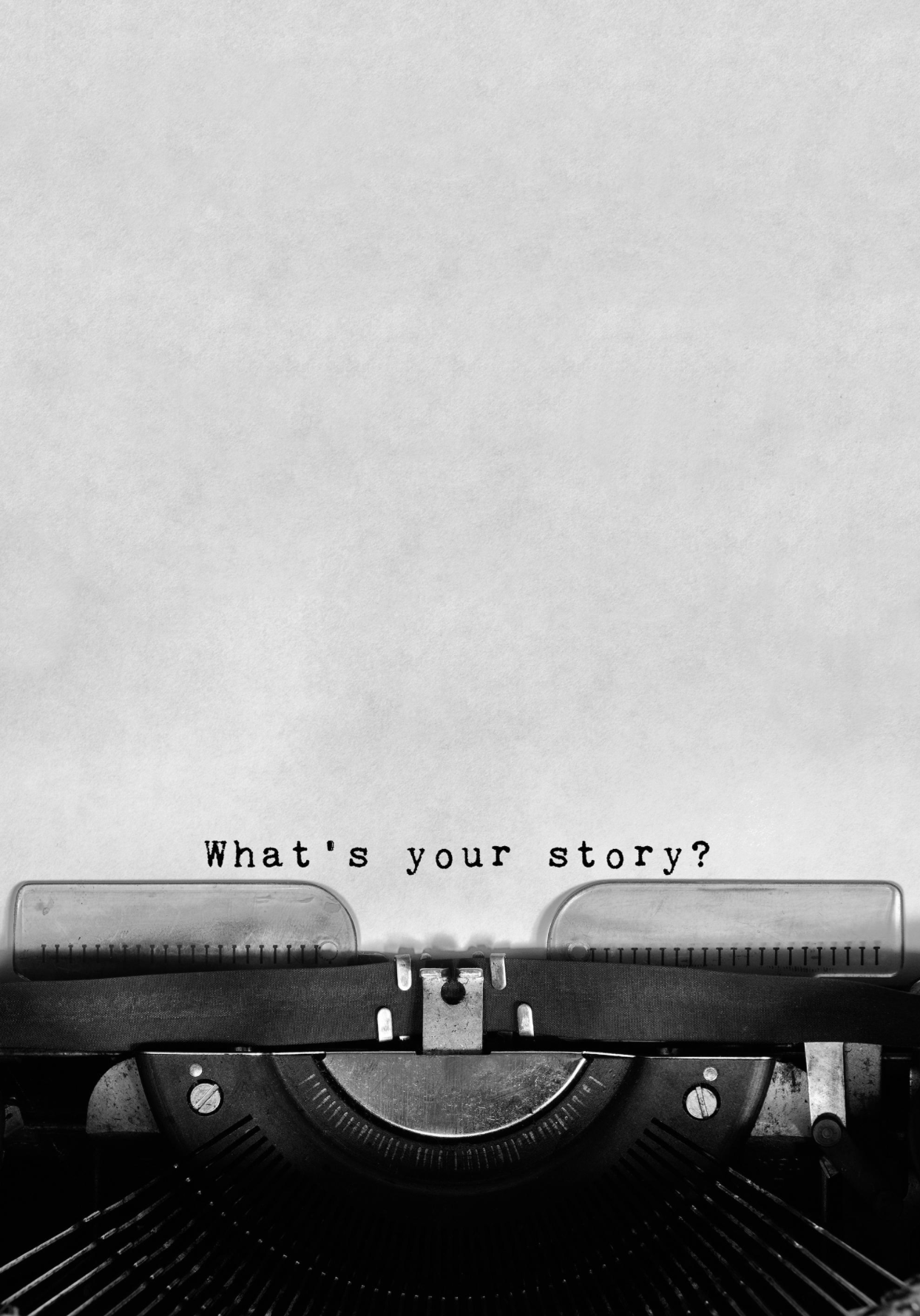 A vintage typewriter with the phrase 'What's your story?' typed on paper.
