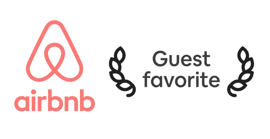 Airbnb logo with a ribbon symbol and a sign that says "Guest favorite" flanked by laurel branches.