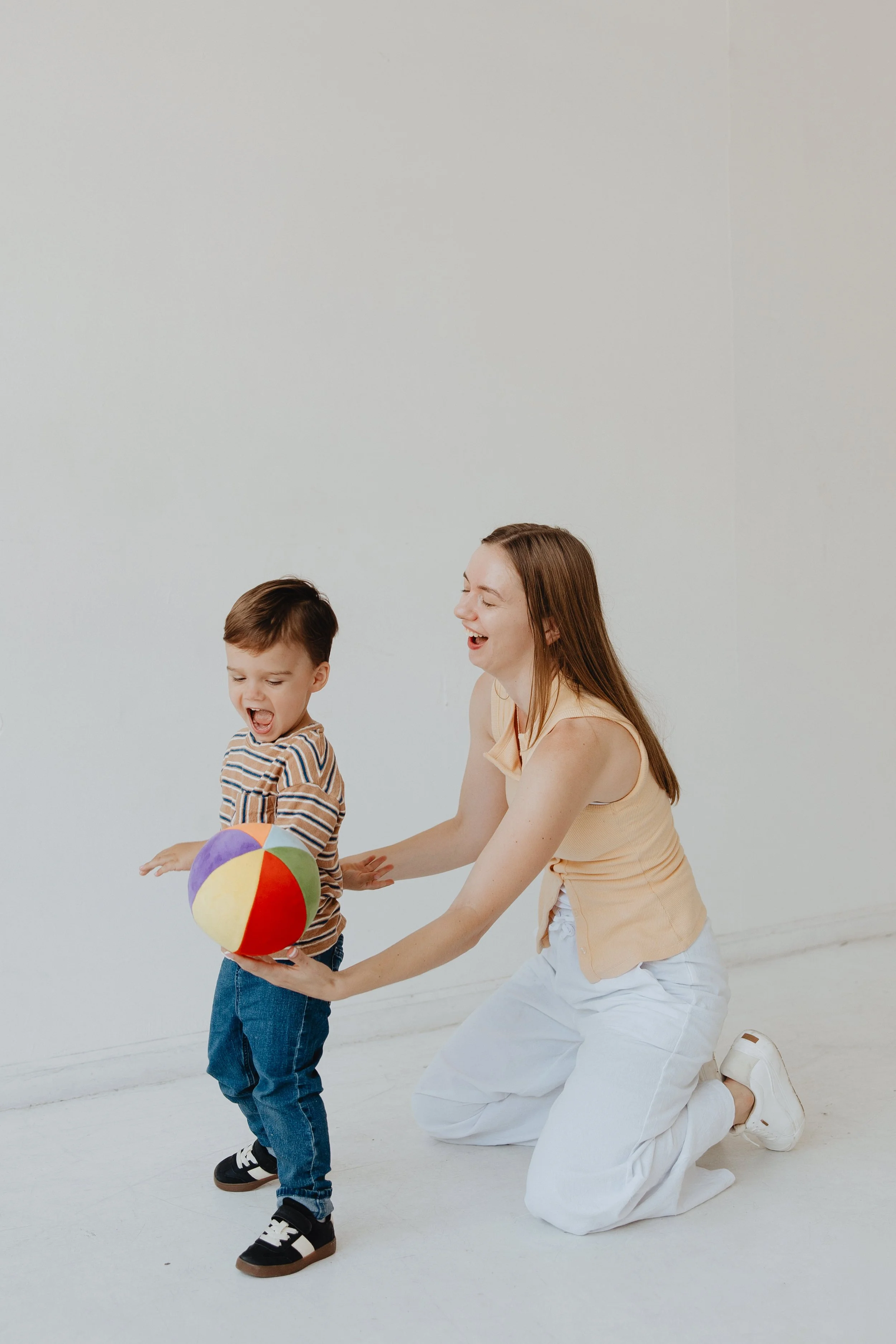 Adult Playing with a ball with toddler