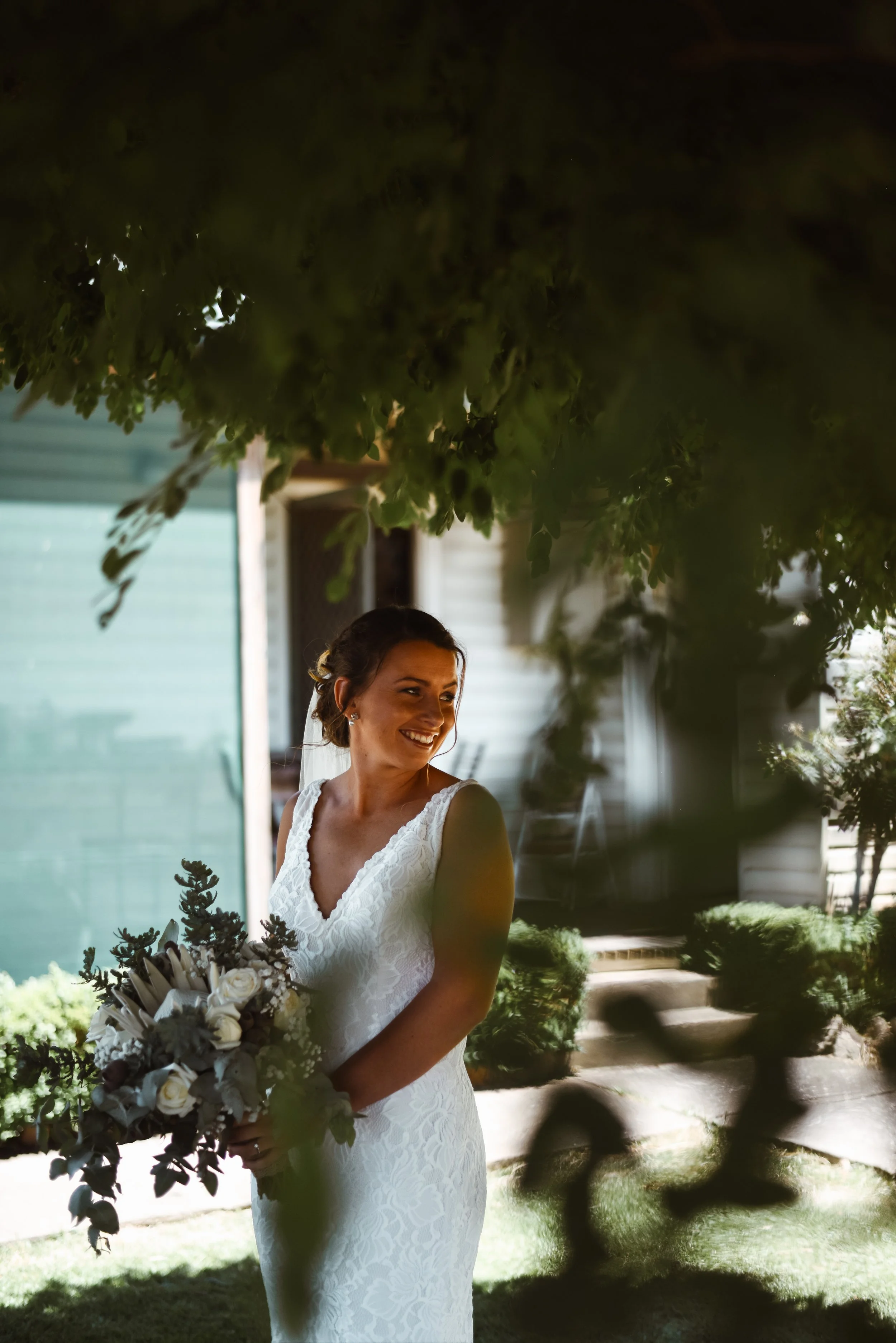 bride looking at her bridesmaids before walking down the isle
