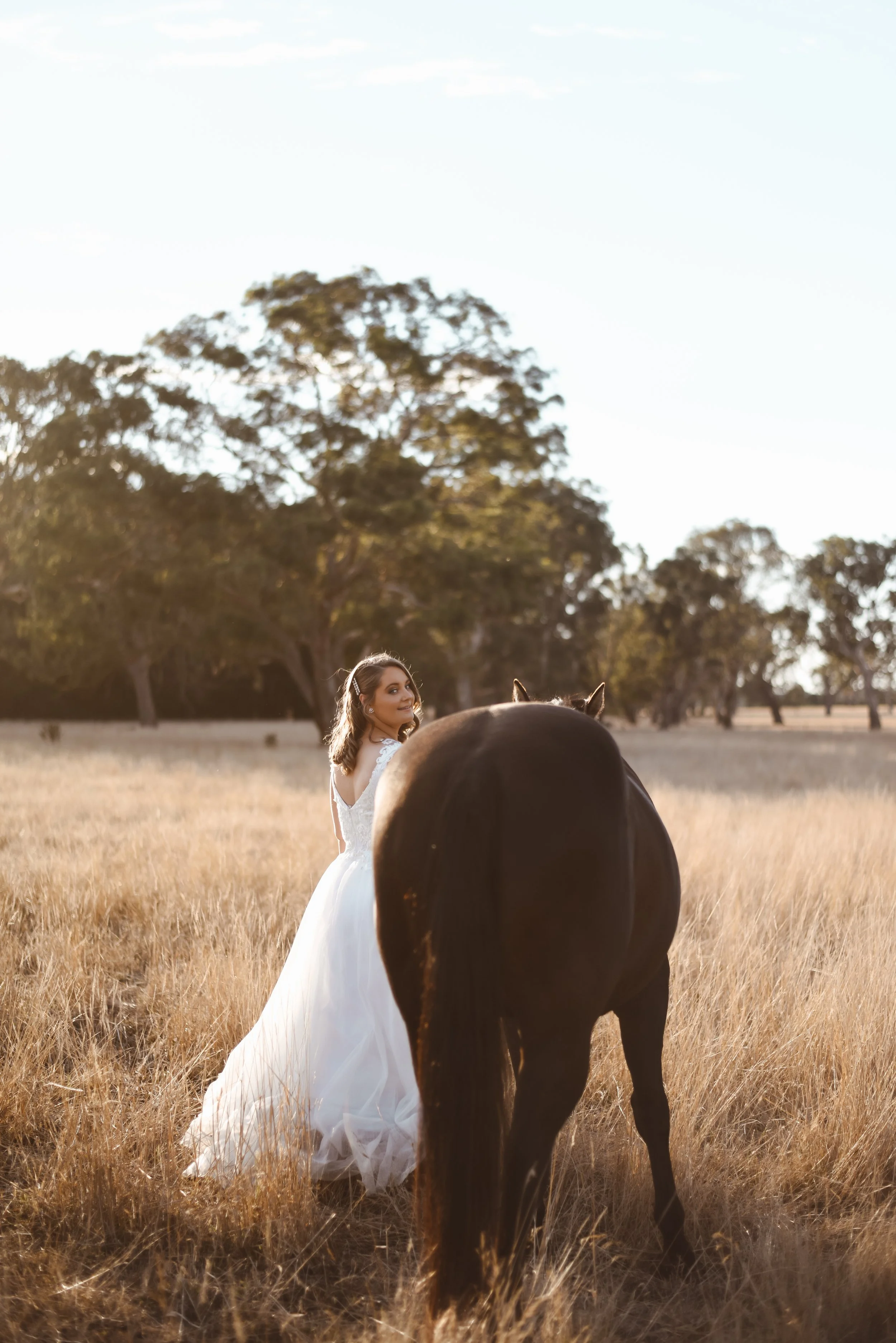Bride leading her horse about to enter her wedding