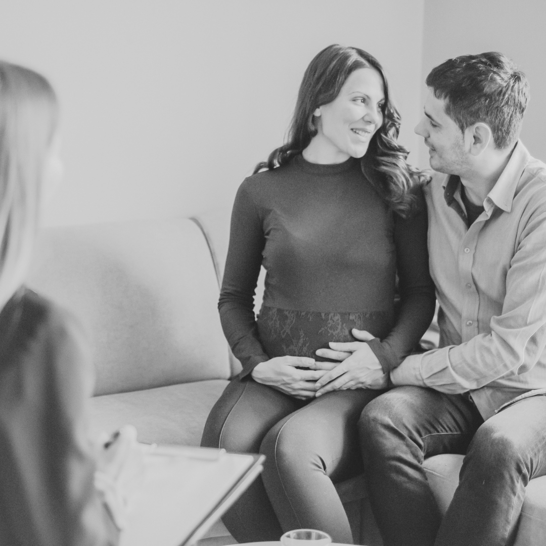 Birth doula meeting with an expecting couple during a prenatal consultation in Portland, Oregon.