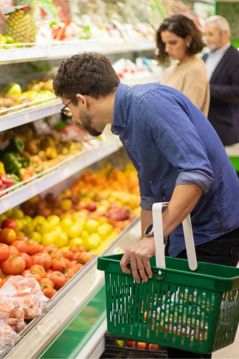 Man choosing supermarket produce