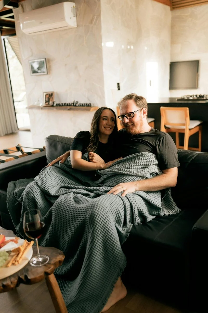 couple resting on couch