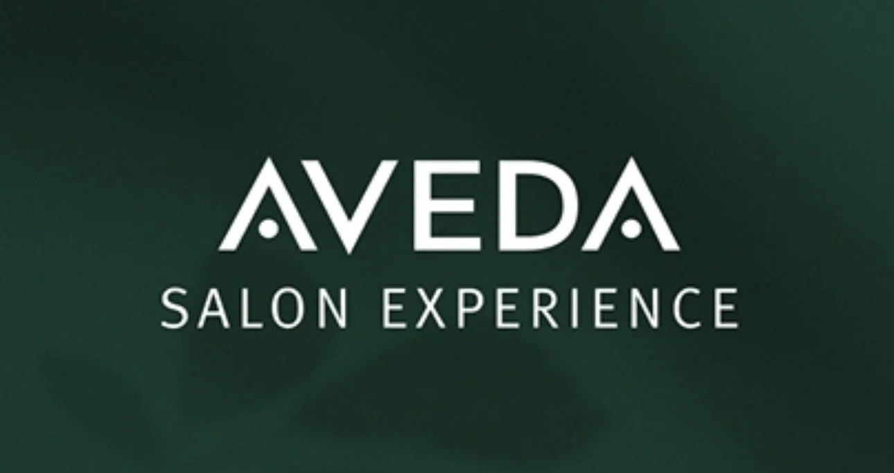 Aveda Salon Experience logo on a green background.