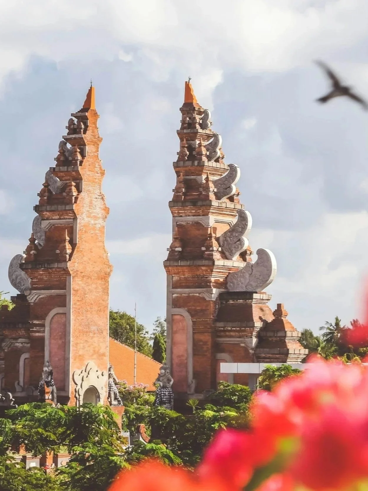 Balinese temple gates opening onto a path, representing transition and pause.