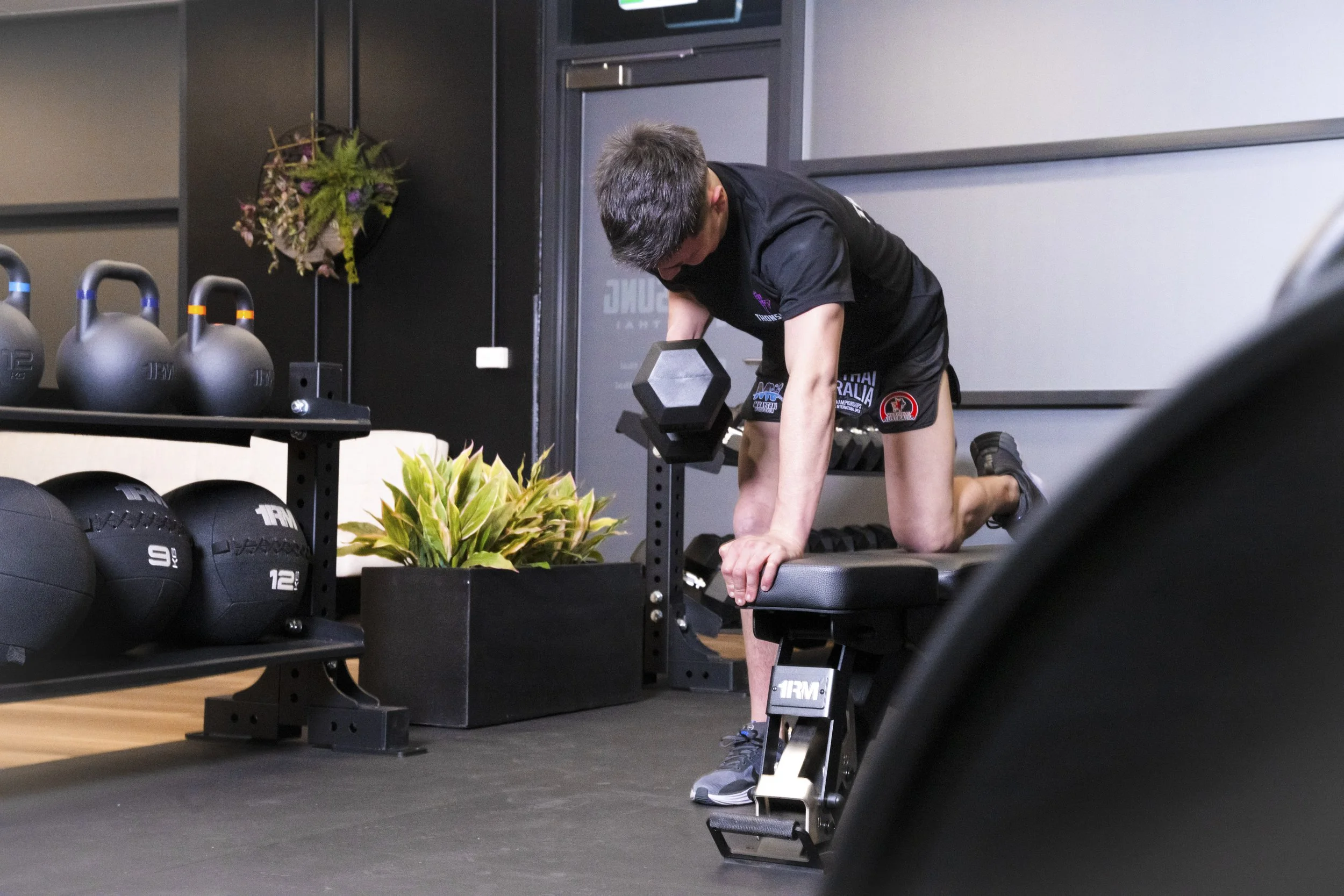 Thonsung Muay Thai, member using Strength and Conditioning area, Epping Victoria.