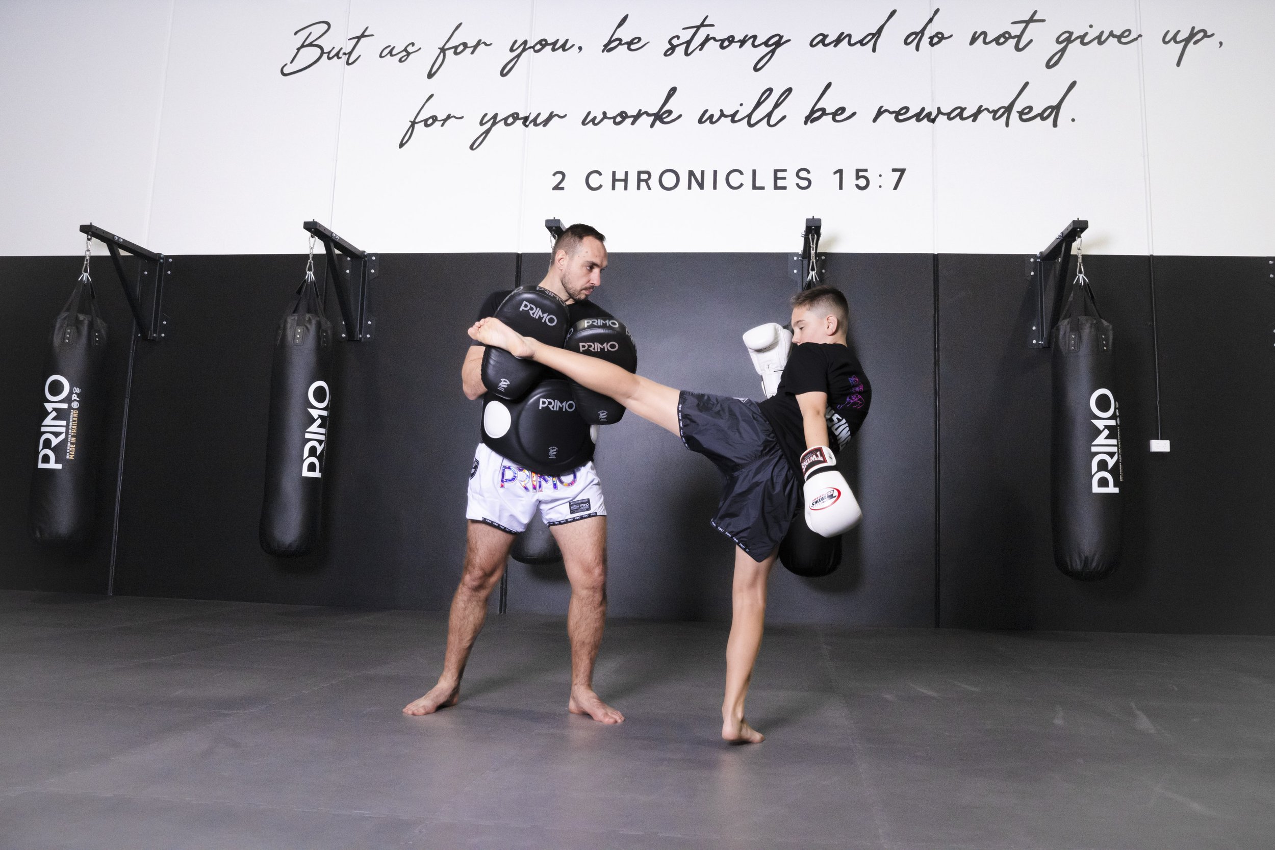 Thonsung Muay Thai Juniors class Epping Victoria - Junior student executing a high head kick.