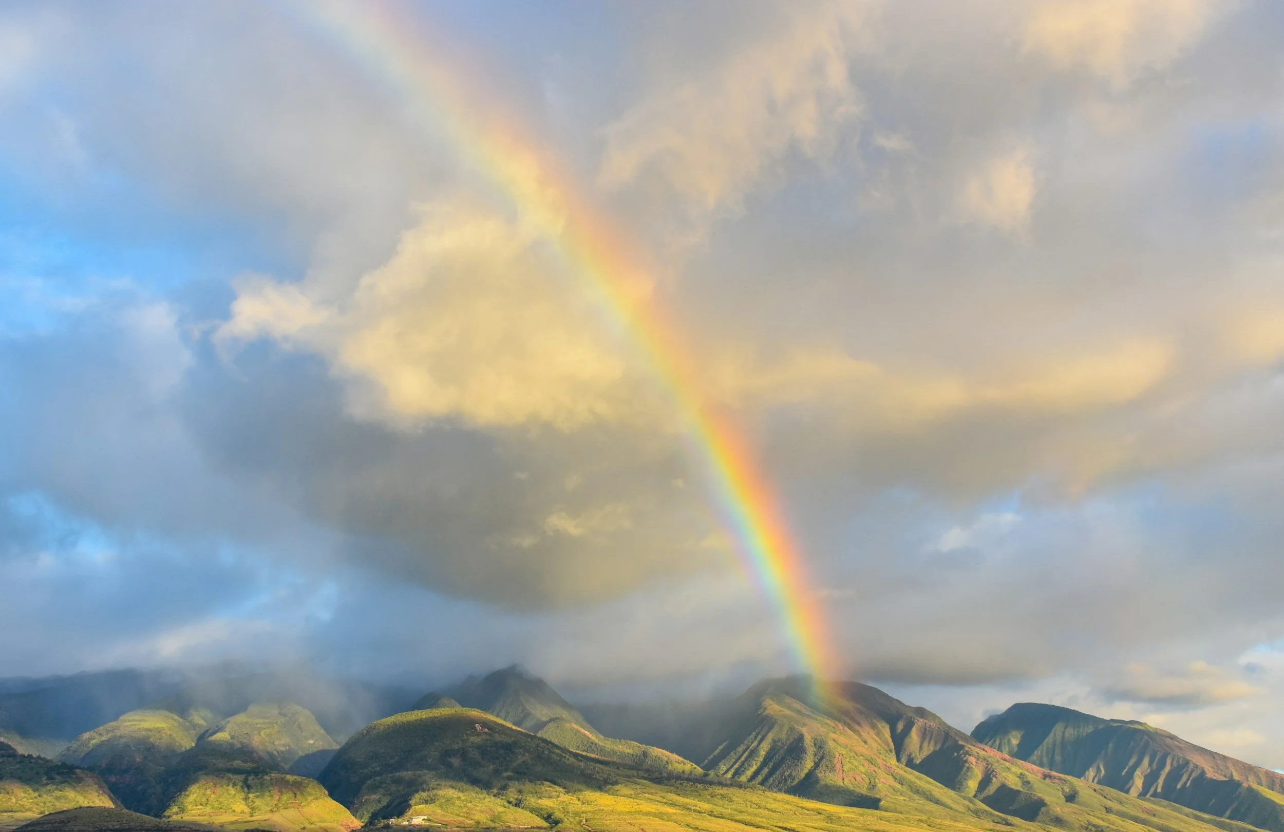 a rainbow over mountains