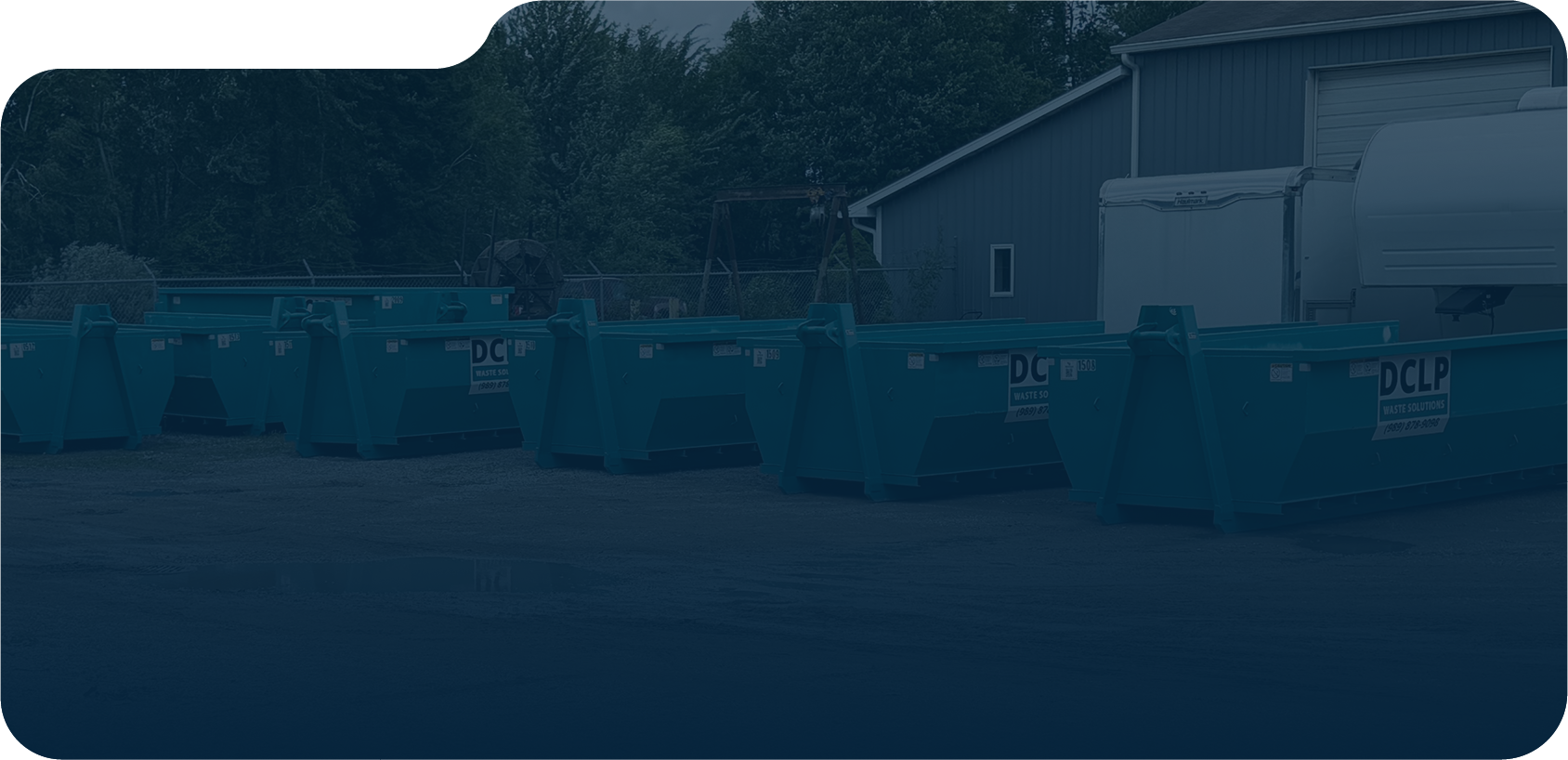 Blue DCLP Solutions roll-off bins for construction, renovation, and property cleanout projects.