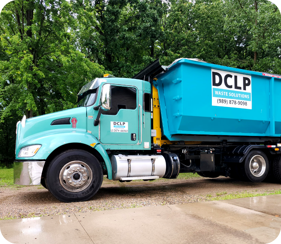 DCLP Solutions roll-off truck delivering waste bins for commercial and residential projects.