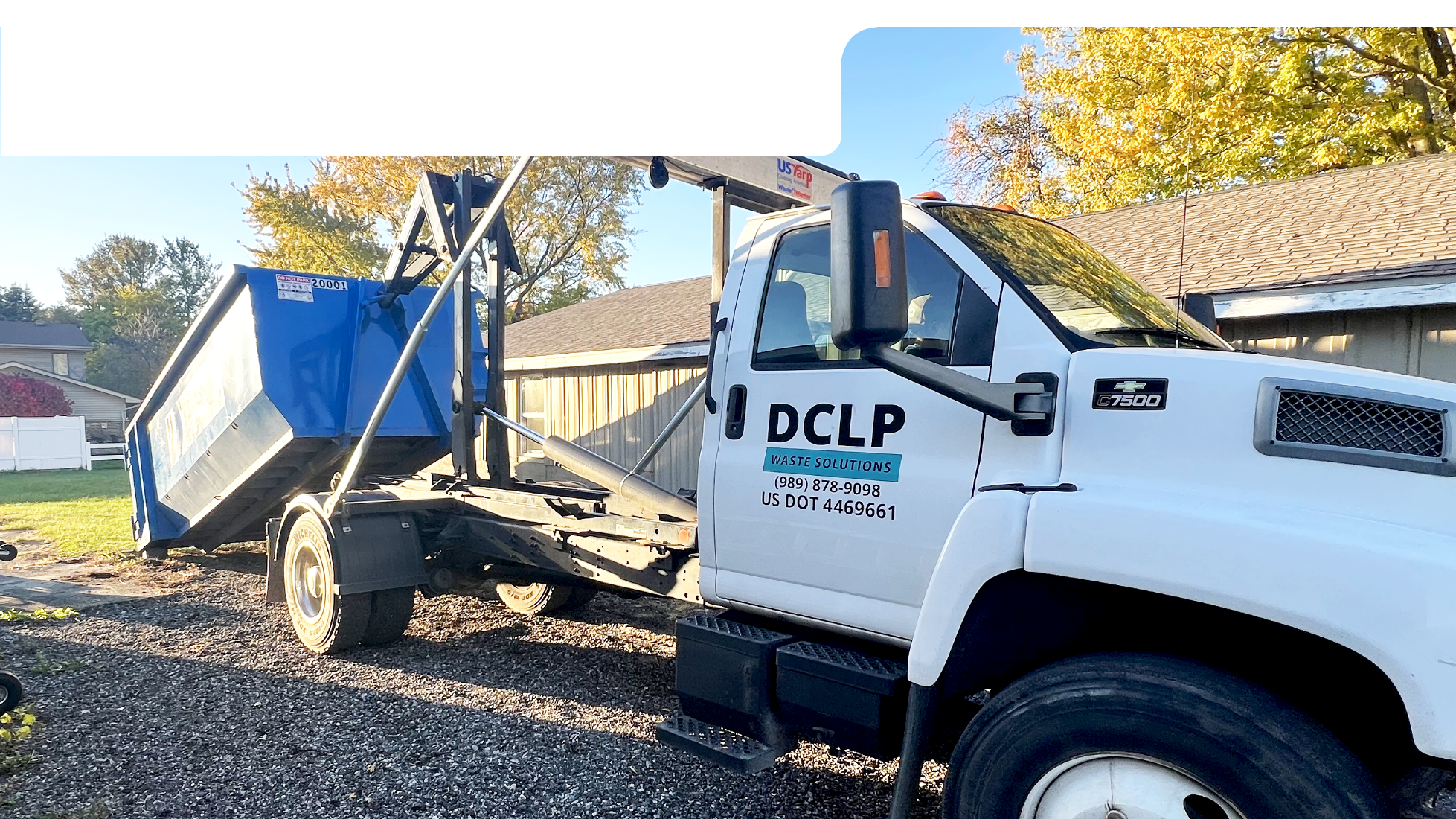 DCLP Solutions roll-off bin delivery truck serving commercial and residential customers.