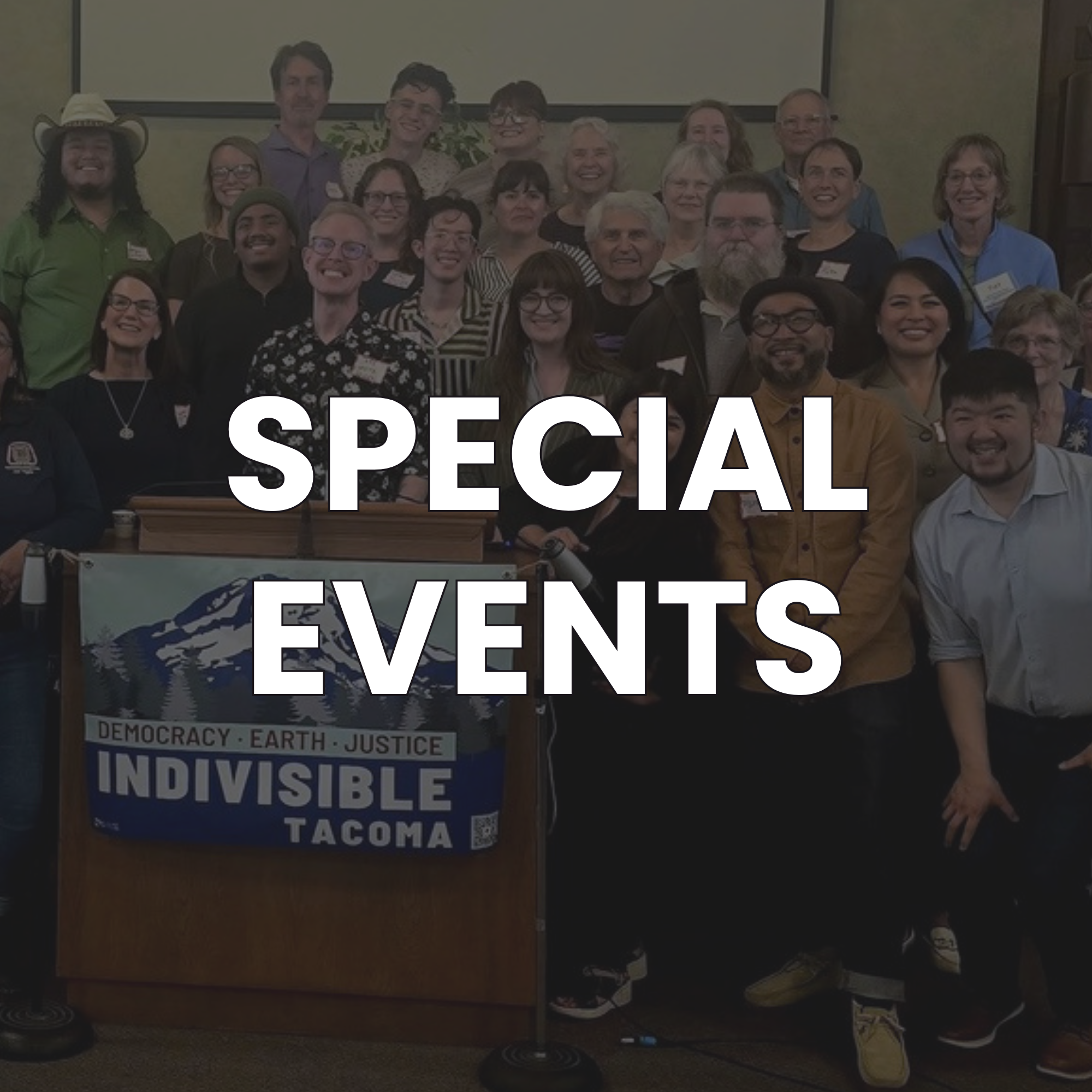 Group of diverse people posing for a photo with a banner that reads 'Indivisible Tacoma' in a conference room setting, with a large white overlay text reading 'SPECIAL EVENTS'.