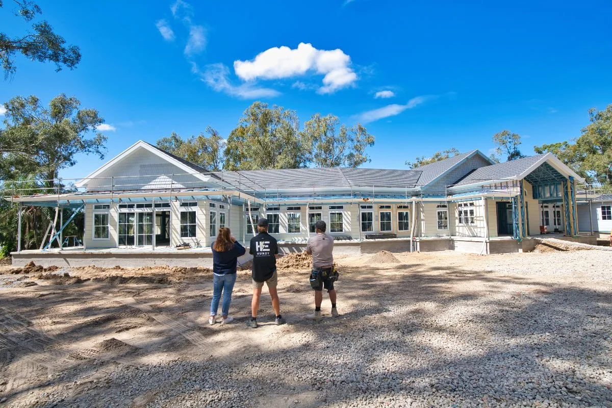 Hundy Electrical electrician meeting with builder and client at new residential build site on the Gold Coast