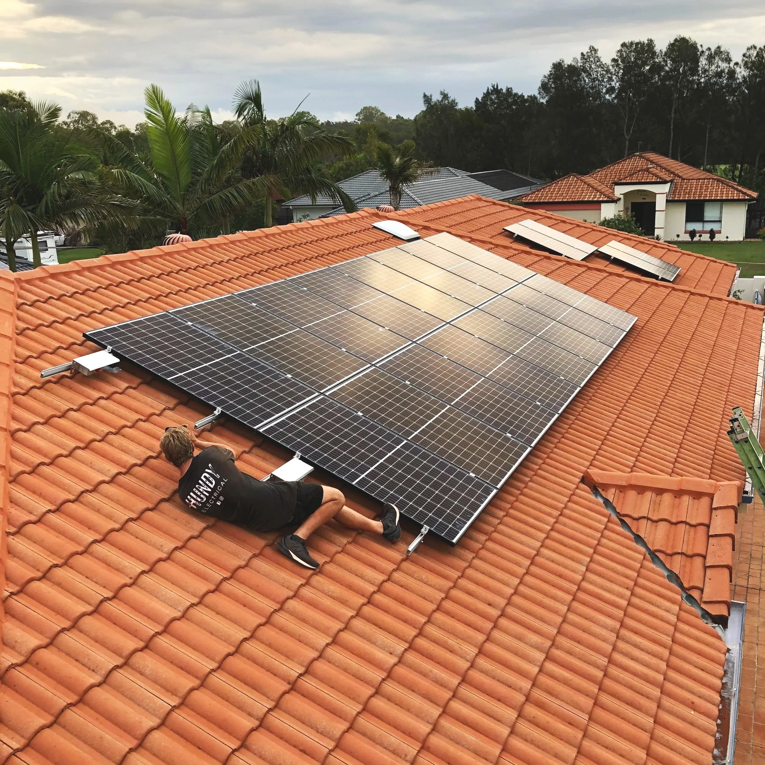 Solar panel installation on Gold Coast residential roof — licensed solar electrician SEQ — Hundy Electrical