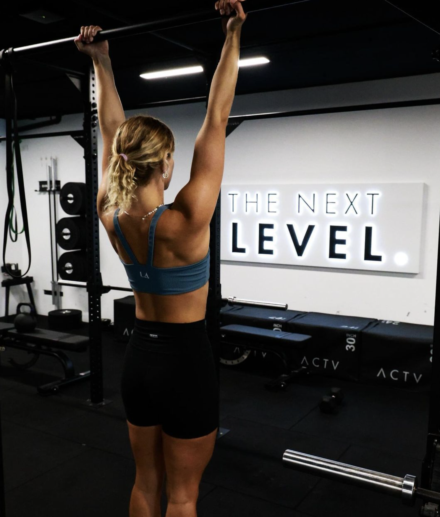 Commercial electrician installing LED feature lighting at ACTIV Gym, Gold Coast