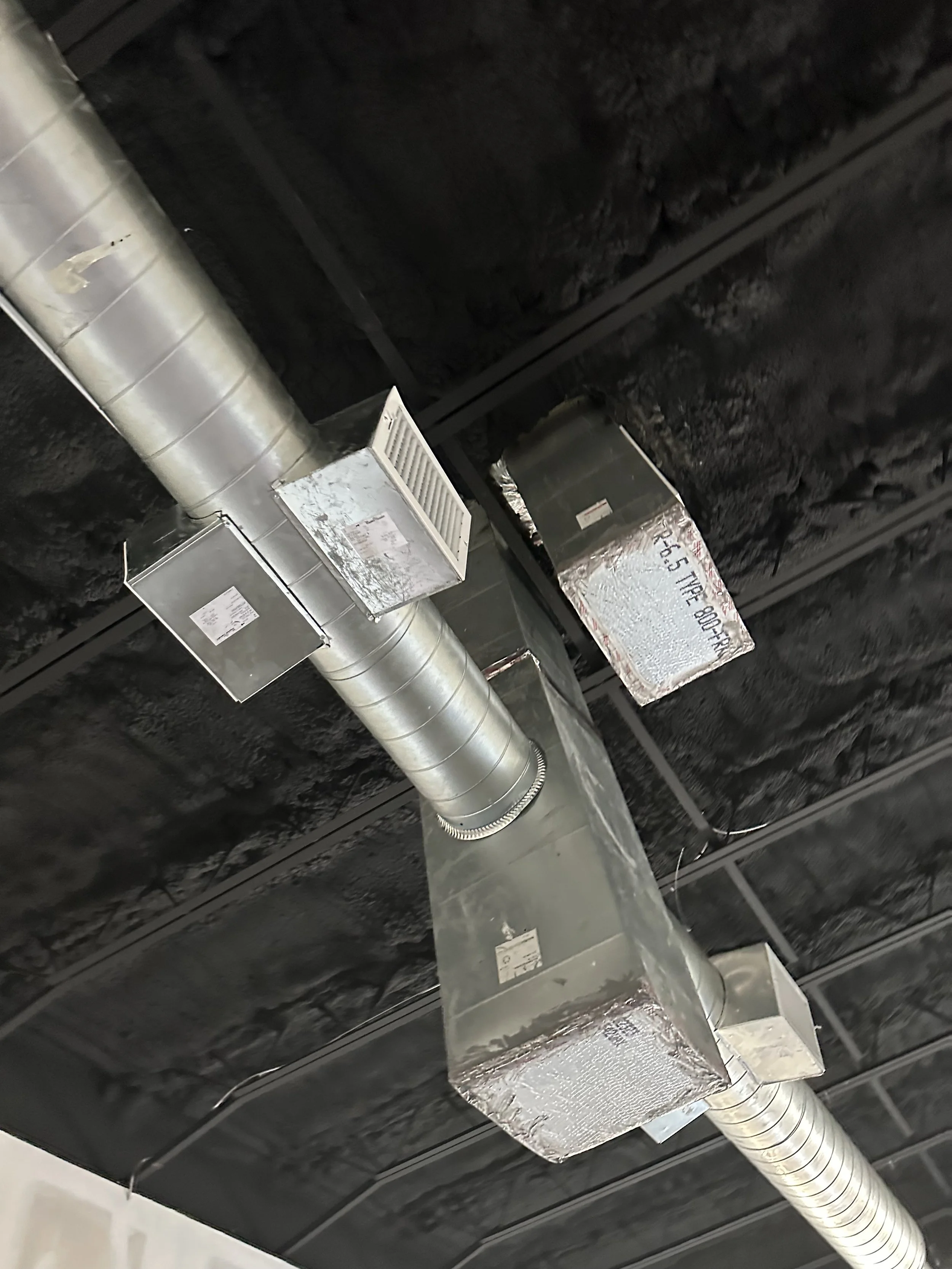 HVAC ductwork and ventilation system installed in a smoke shop