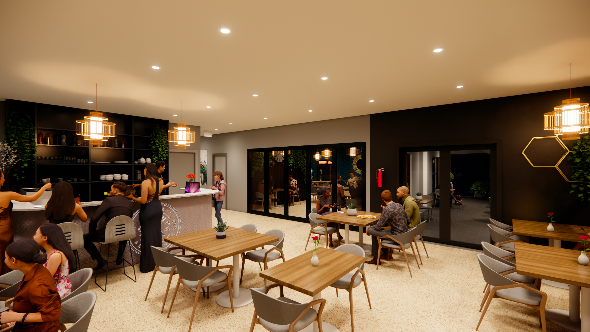 A modern dining area in a restaurant with tables decorated with small potted plants and chairs. There are people sitting and conversing, and a bar counter with a few women and a man standing nearby. The space has black walls, wooden accents, and pend