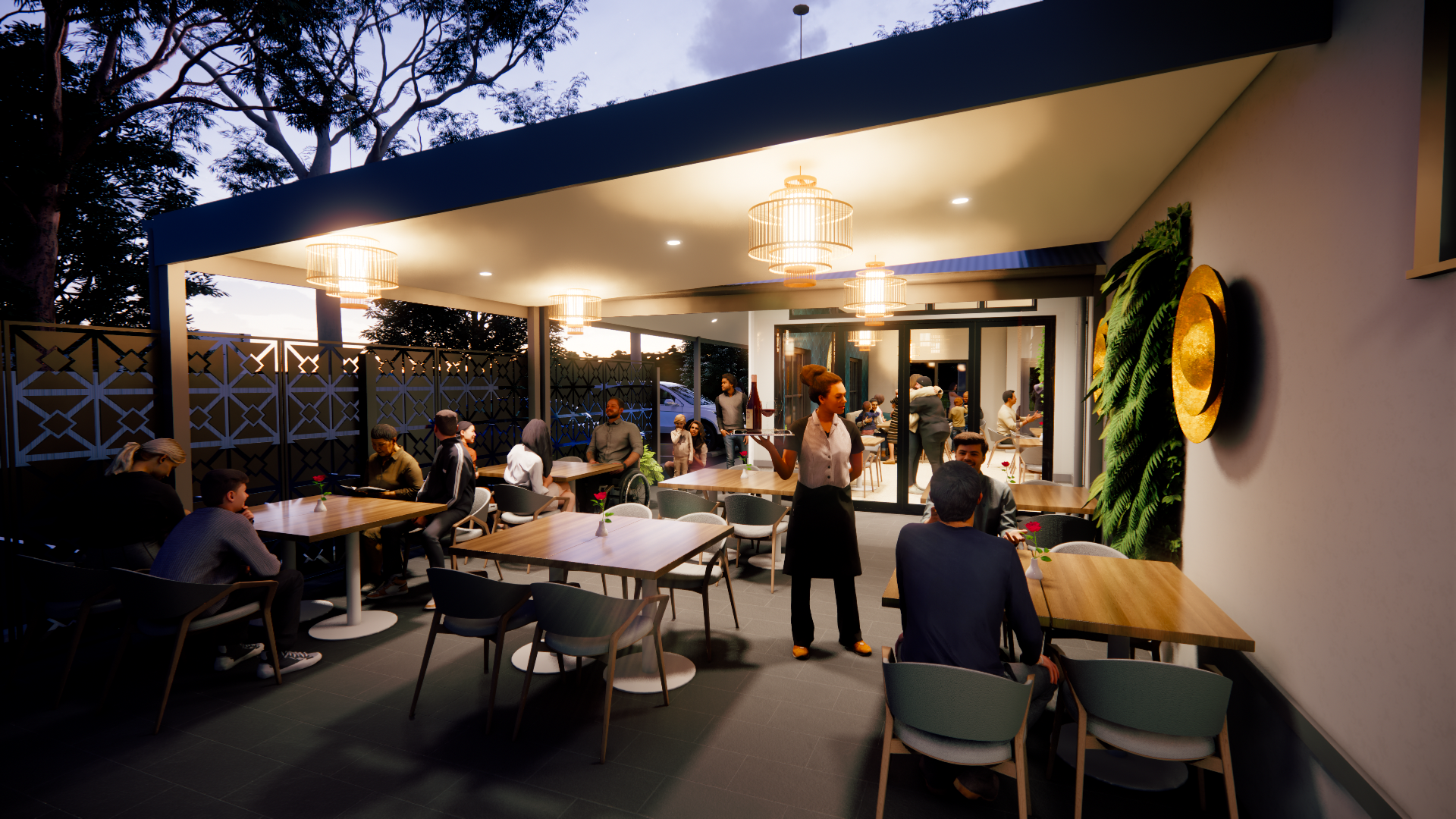 A bustling outdoor restaurant or cafe during evening with patrons dining and a server in a white top and black apron holding a tray. The space has modern decor, including hanging lights, a decorative green wall, and a patterned fence. Inside, more cu