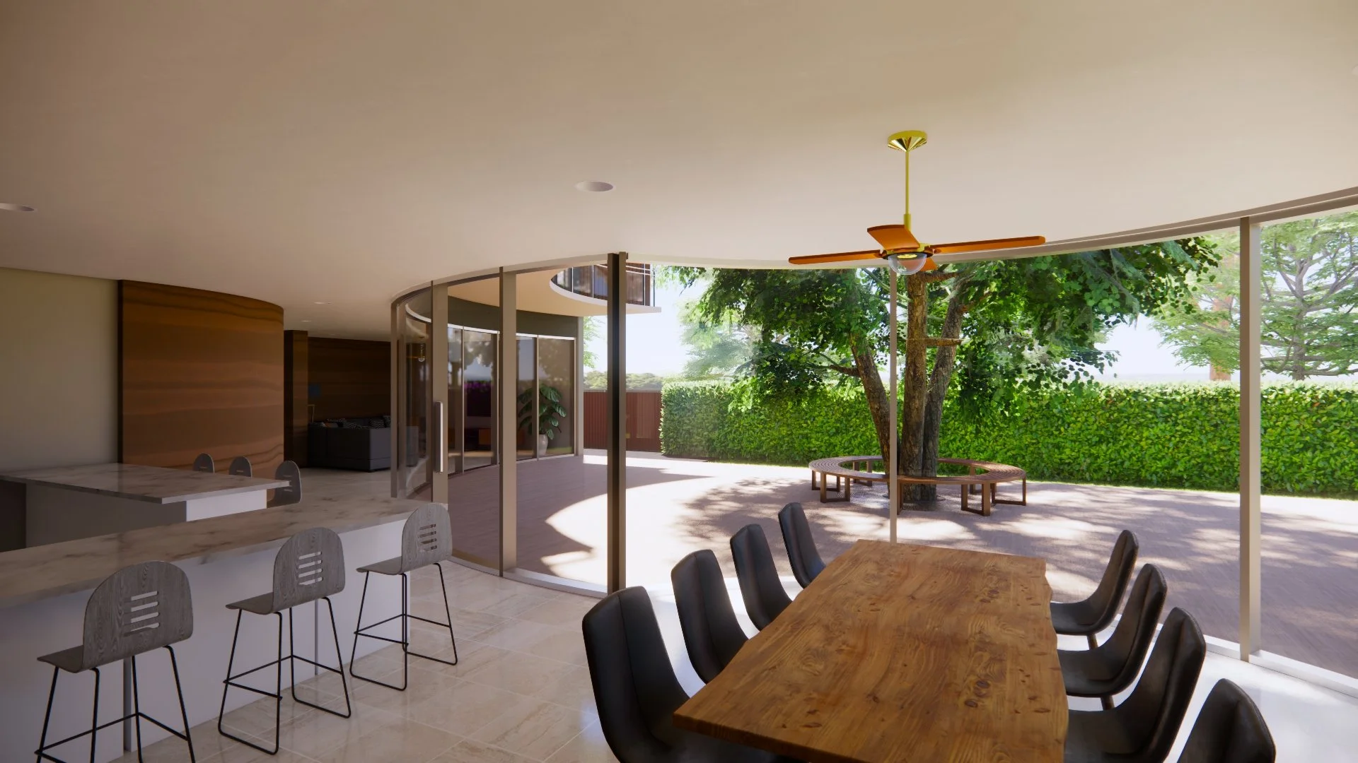 Dining space designed to bring the outdoors in, with floor-to-ceiling windows framing views of greenery and filling the home with natural light.