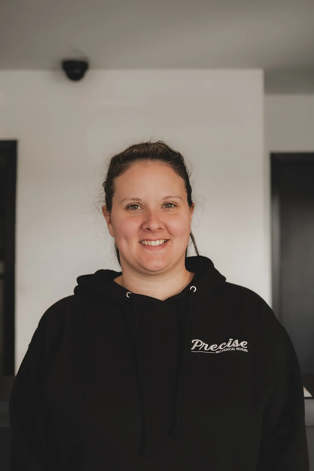 Woman with Precise Logo's shirt