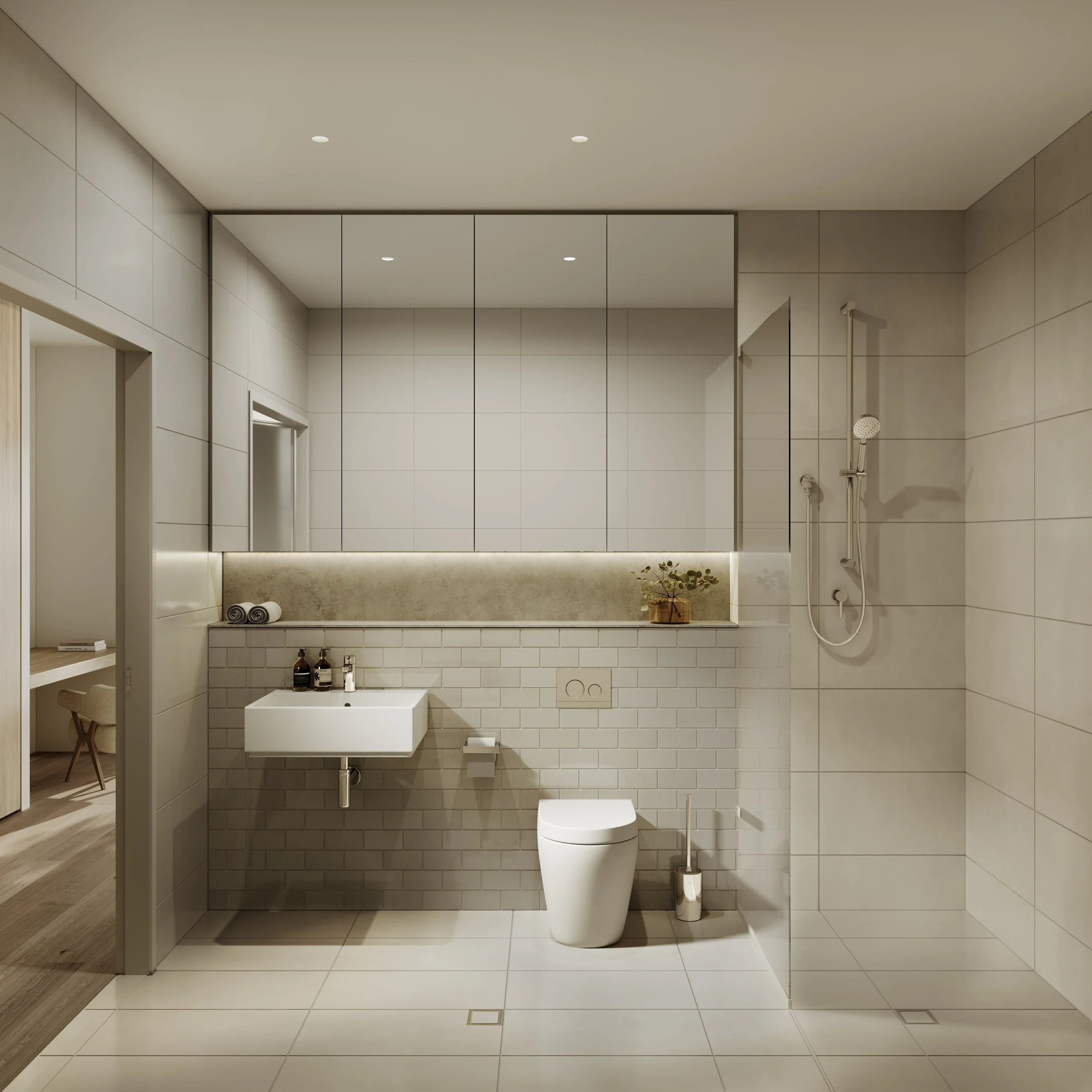 Modern bathroom with a walk-in shower, wall-mounted toilet, and small sink, featuring beige and white tiles and minimal decor.