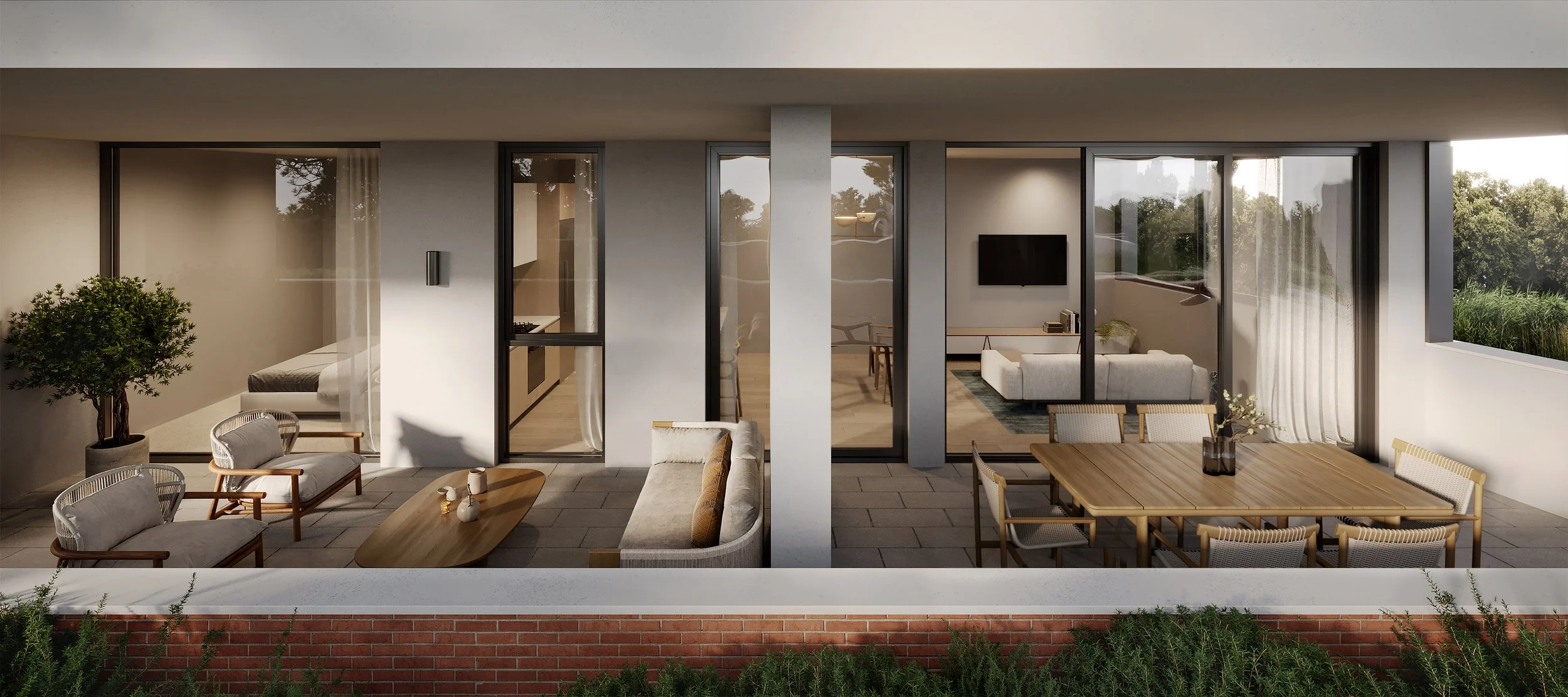Modern apartment balcony with outdoor seating and dining area, view into living room and kitchen through large glass windows.