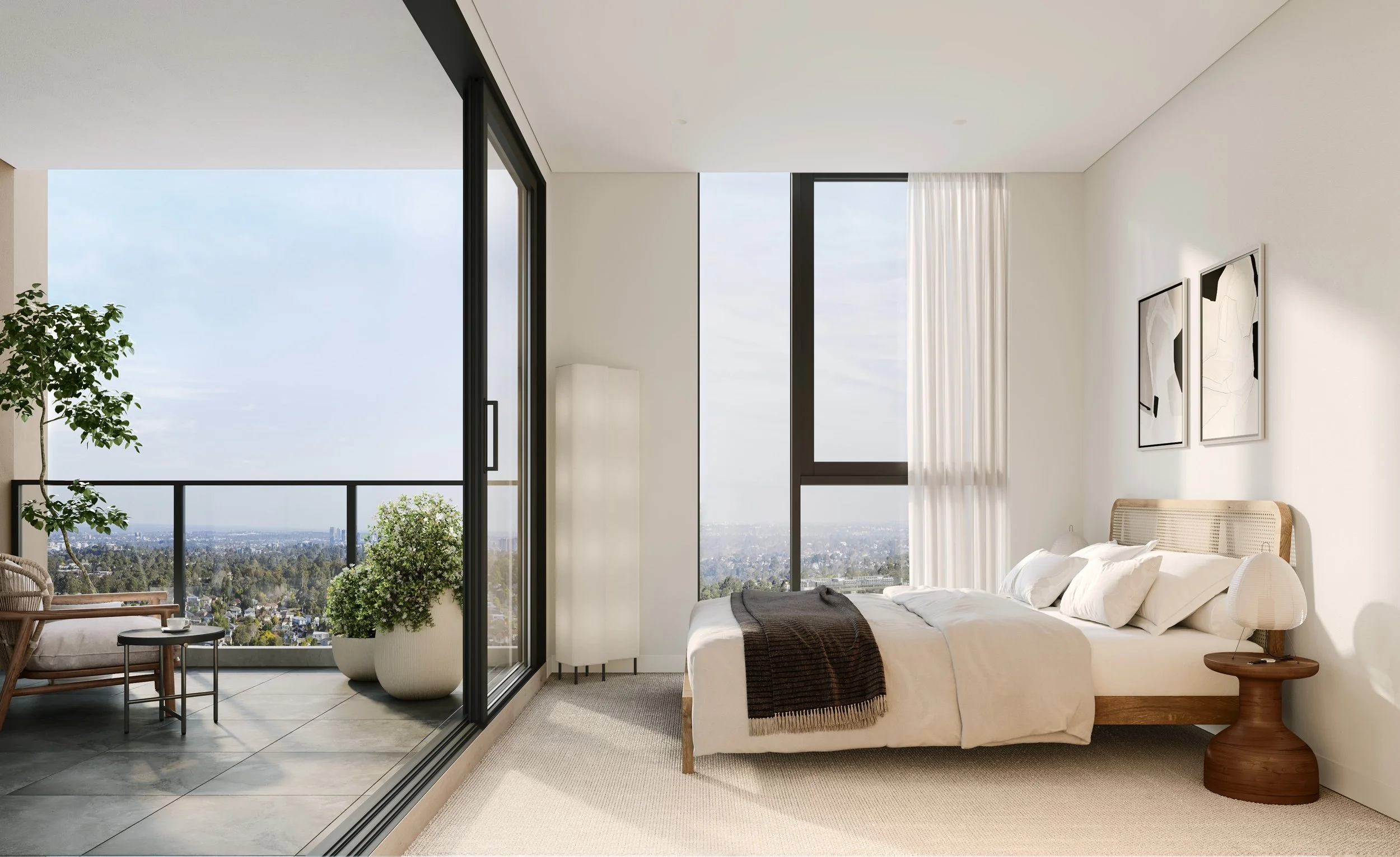 Modern bedroom with a large bed, wooden side table, and abstract wall art, opening to a balcony with outdoor seating and city view.
