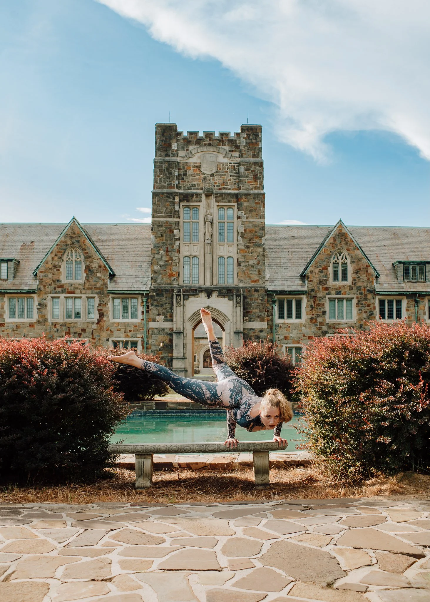 Contortionist posing for branding session in front of architectural building at Berry College by Raquel Zane Photography