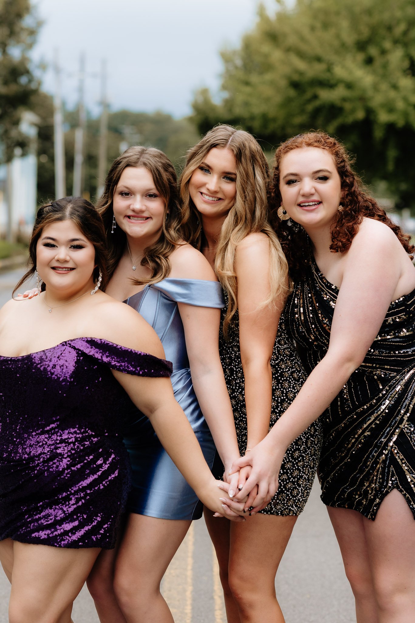 Group of friends dressed for homecoming during a group portrait session in Rome, Georgia by Raquel Zane Photography
