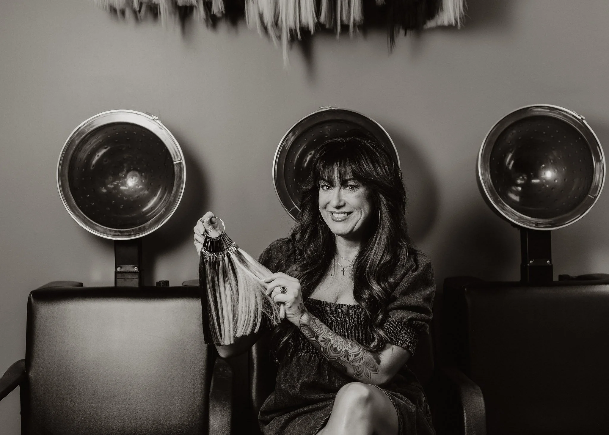 Black and White image of hairstylist branding session in salon