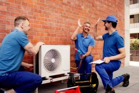 HVAC technicians performing commercial facility maintenance and system service