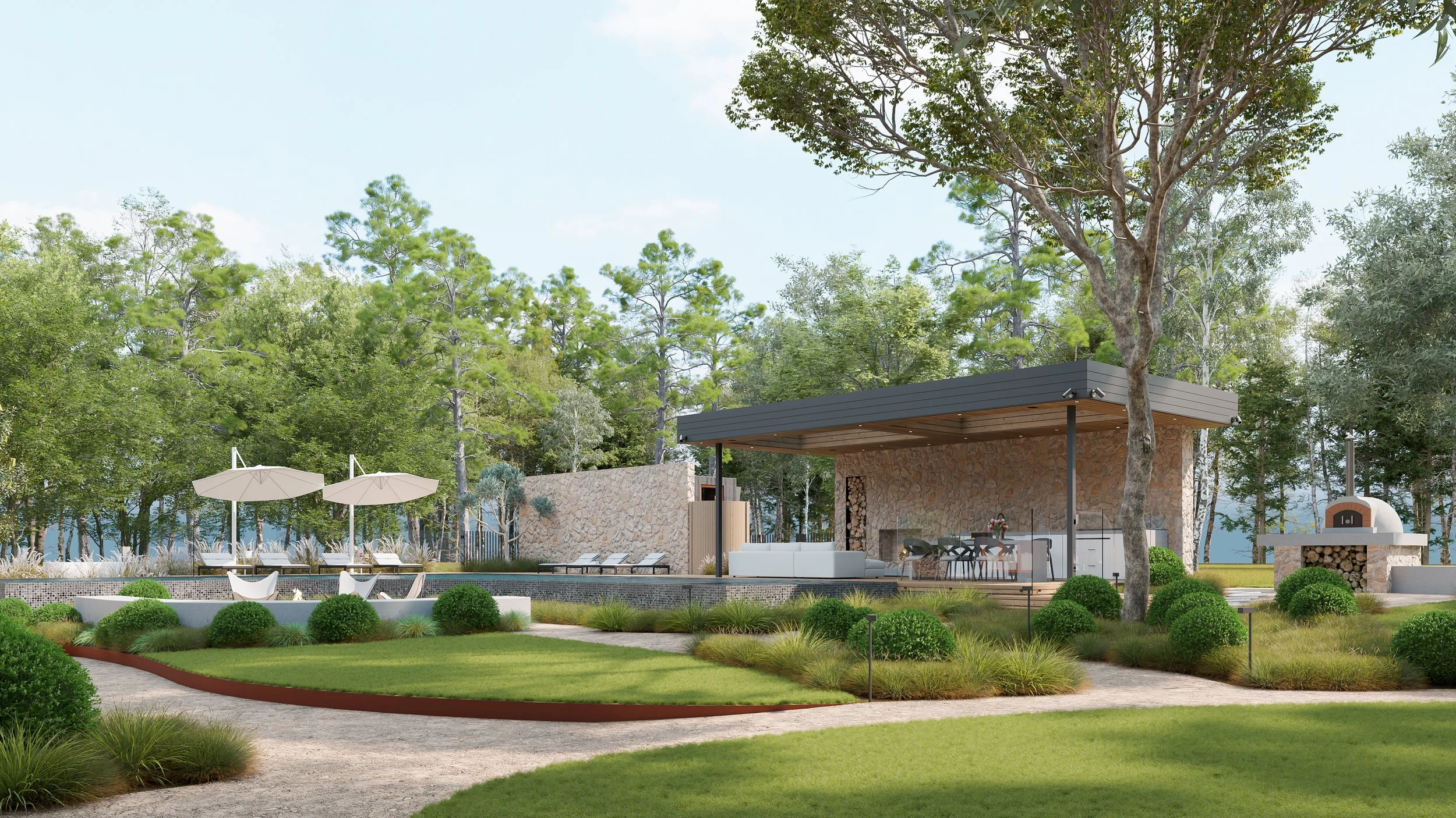 Outdoor lounge with seating, umbrellas, a stone fireplace, and a garden in a wooded setting under a blue sky.