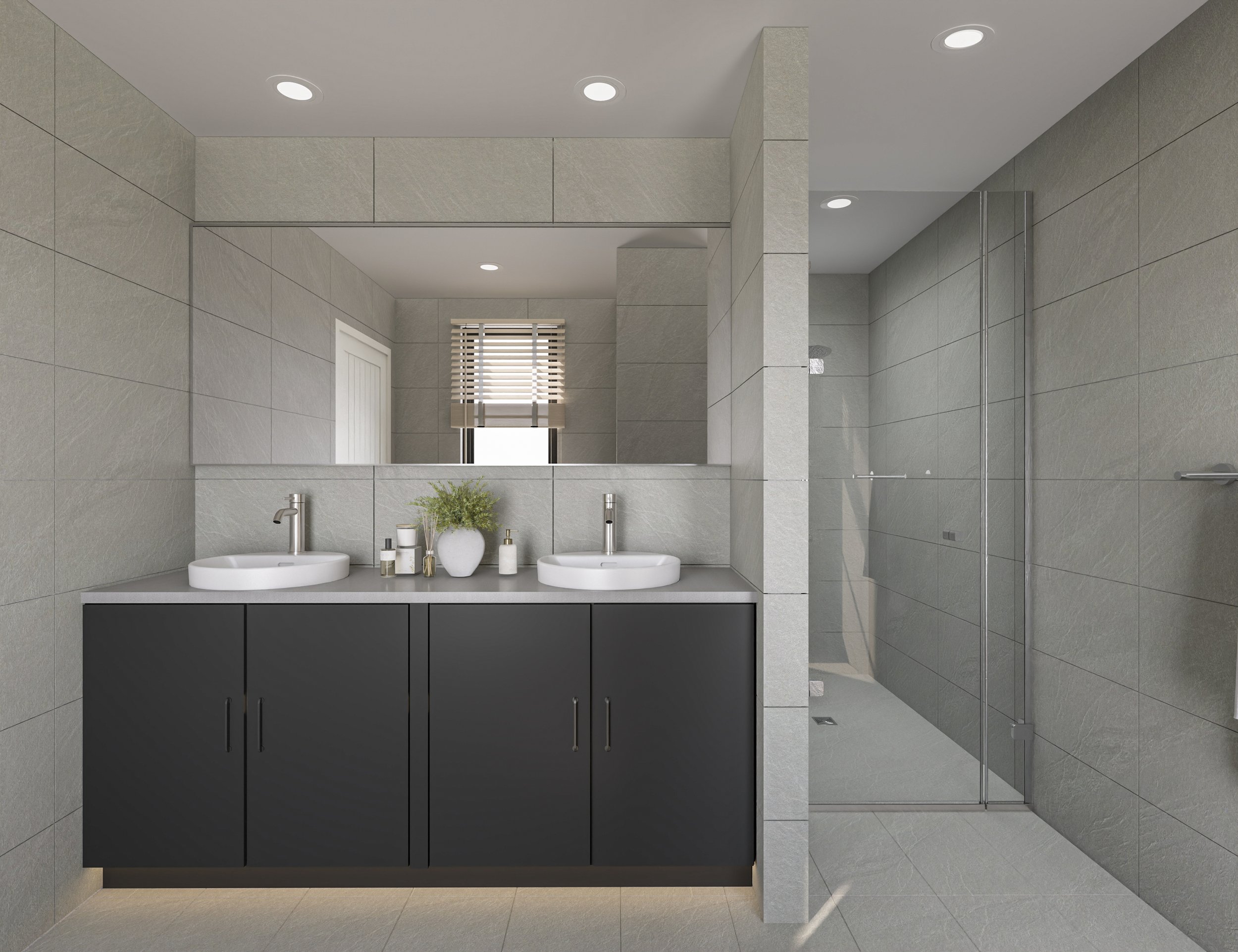 Modern bathroom with dual sinks, a large mirror, a black vanity cabinet, gray tile walls, a window with blinds, and a walk-in shower with glass door.