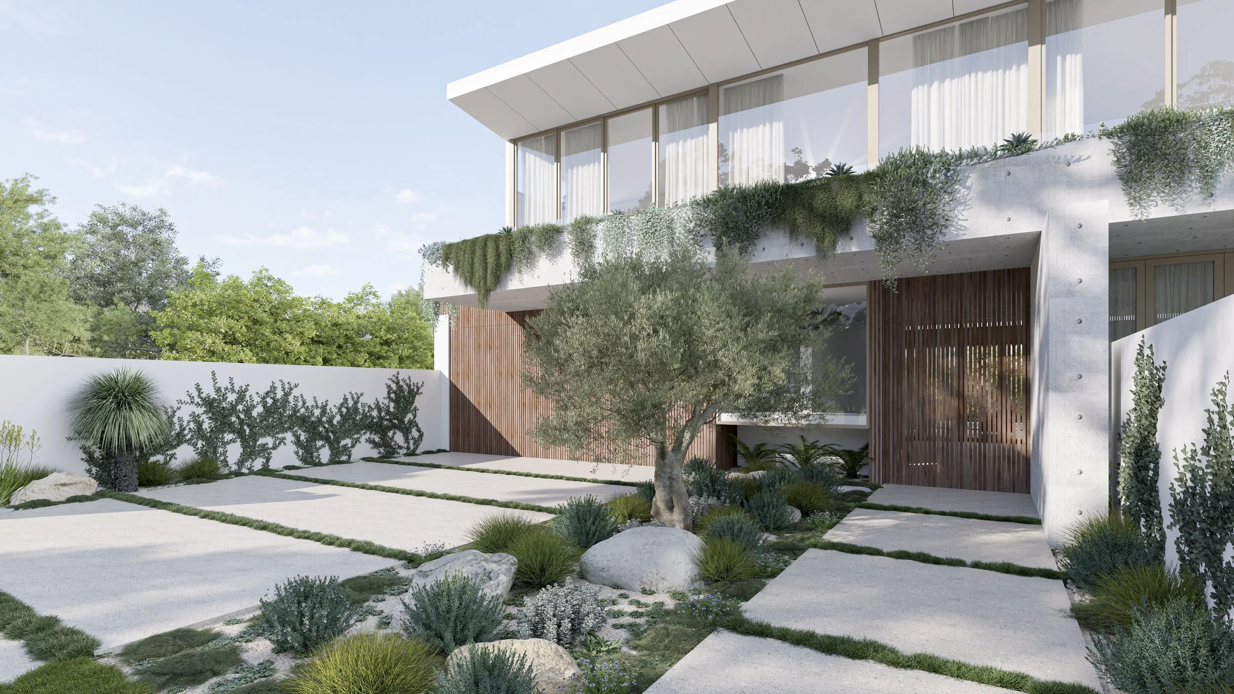 Modern residential building with large glass windows, white walls, wooden accents, and landscaped front yard with a small tree, rocks, and drought-tolerant plants.