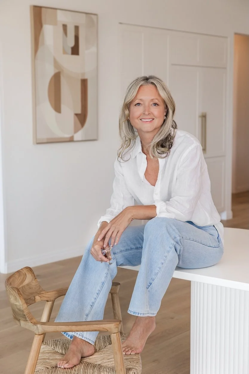 Anna Hutchins, clinical nutritionist, sitting in a bright, modern room.