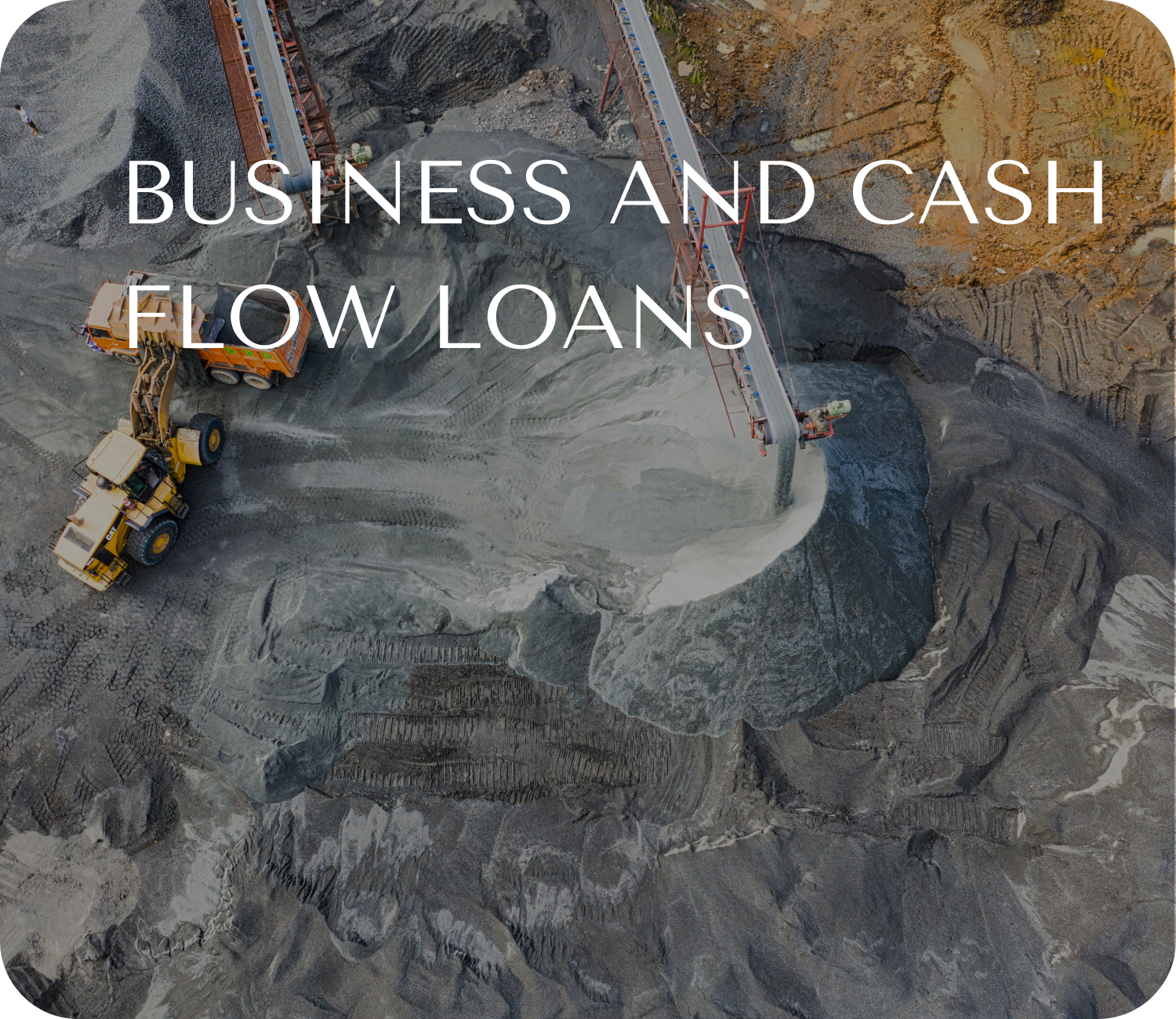 An aerial view of a construction site with large rocks and machinery for business and cash flow lending solution at Baseline Financial