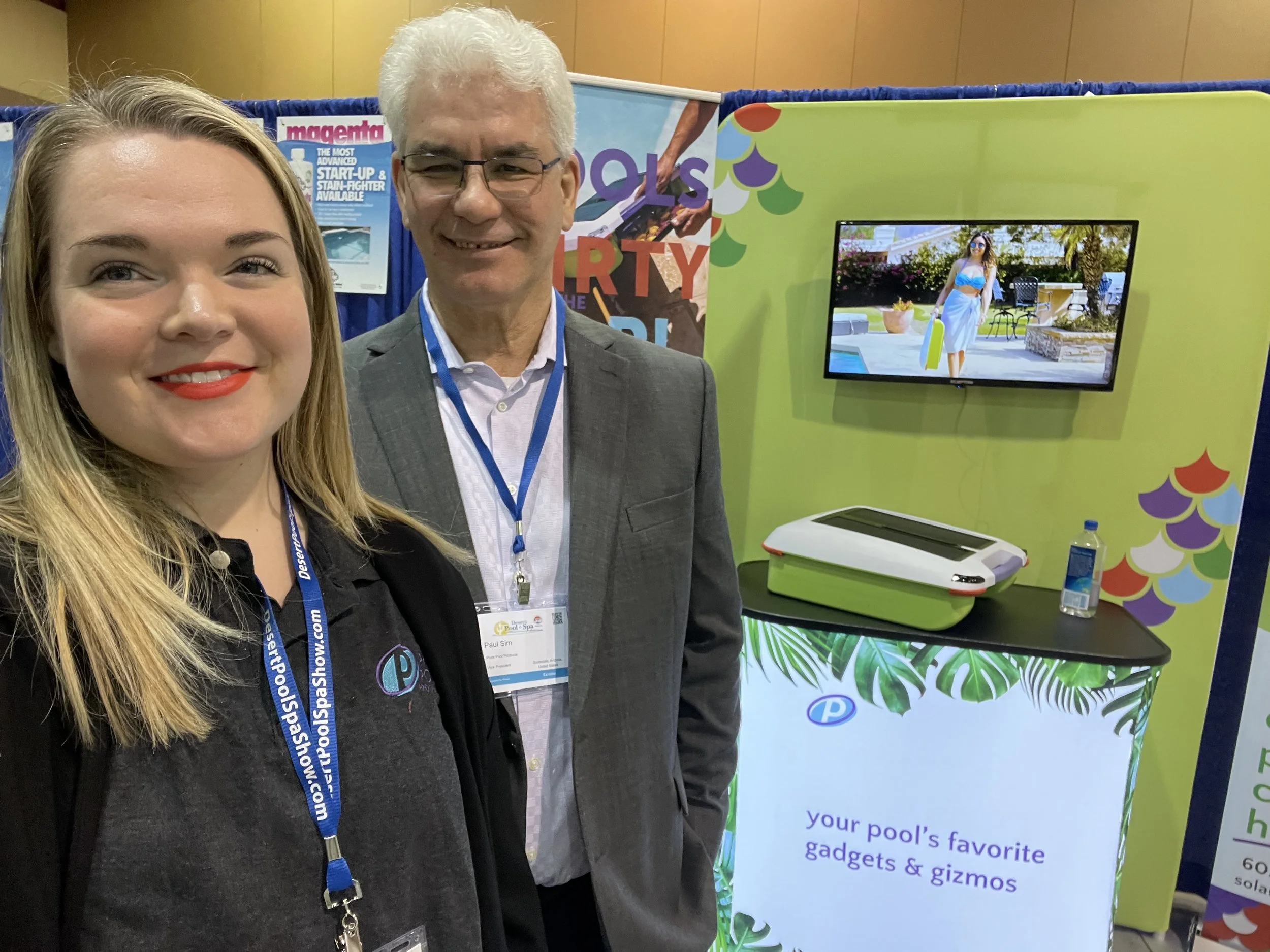 Taylor Cole of Be Sound PR represents Ariel the pool skimming robot at a pool industry tradeshow in Phoenix.