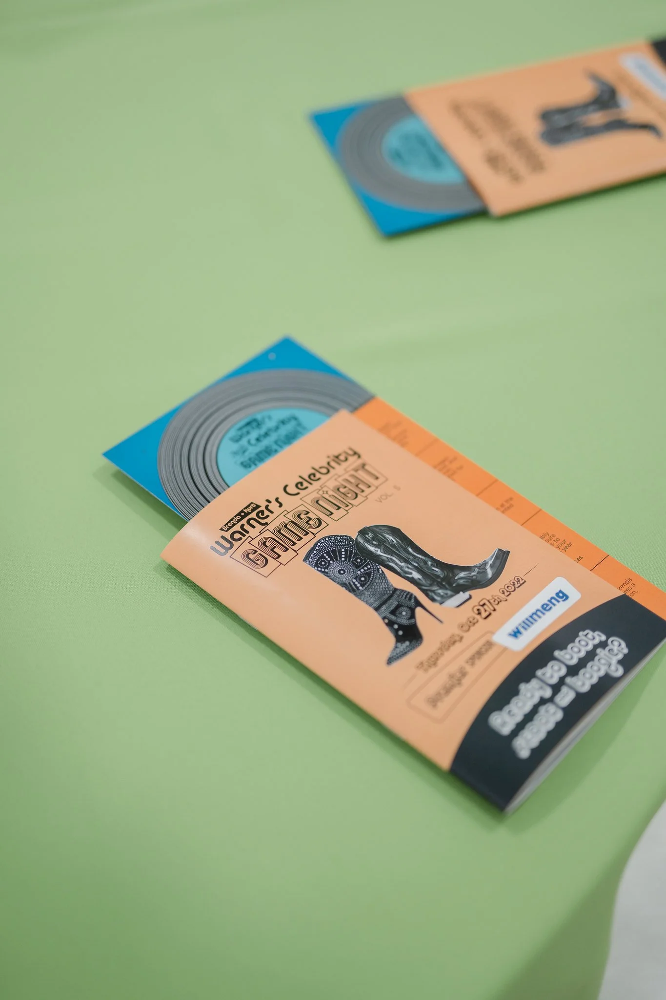 Brochures for Warner's Gallery of Modern Art on a light green table