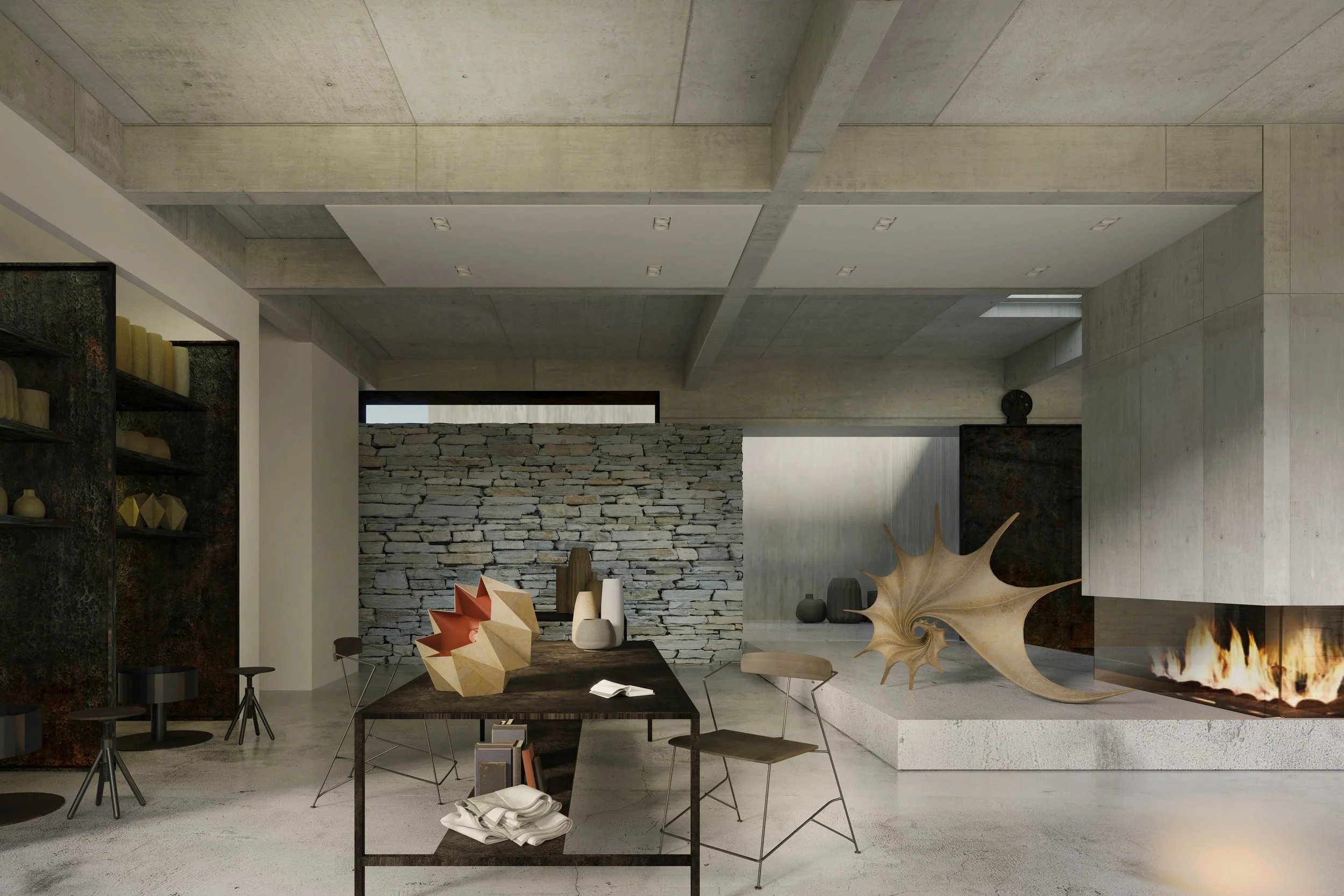 Modern living room with concrete walls, stone fireplace, and contemporary decor sculptures on a dark wooden table.