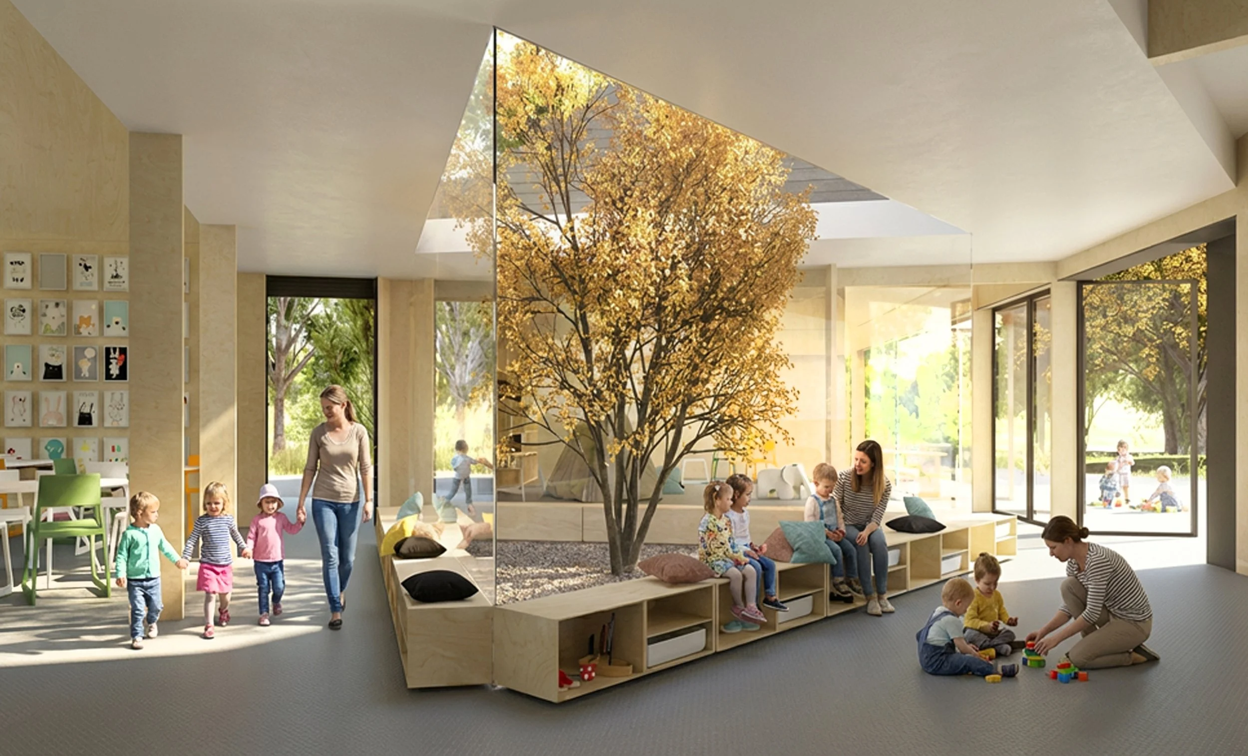 Children and adults in a bright indoor playroom with large windows, a decorative tree, and a cozy seating area.