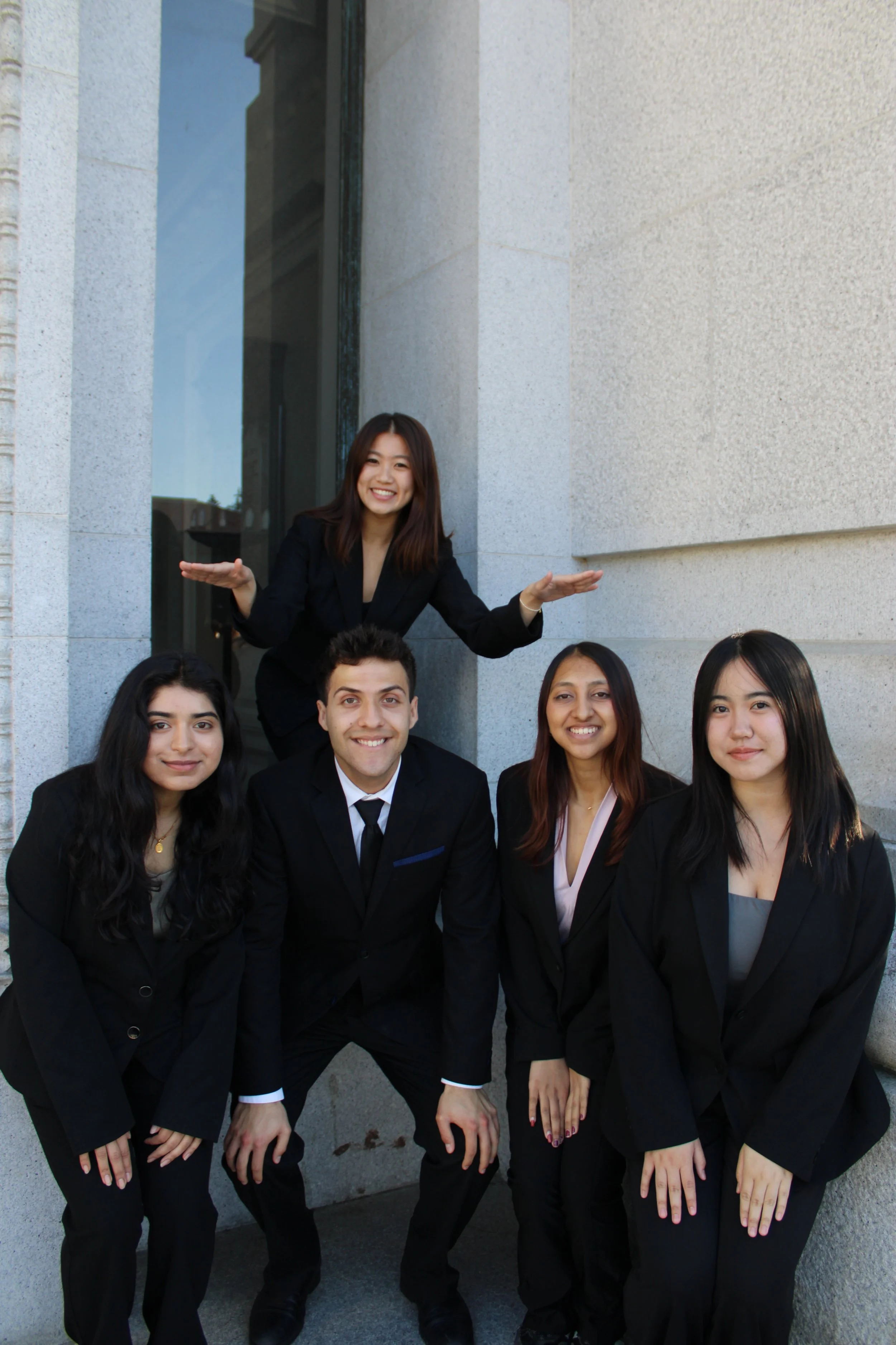 ASRB members standing in two rows, with one person on the top!