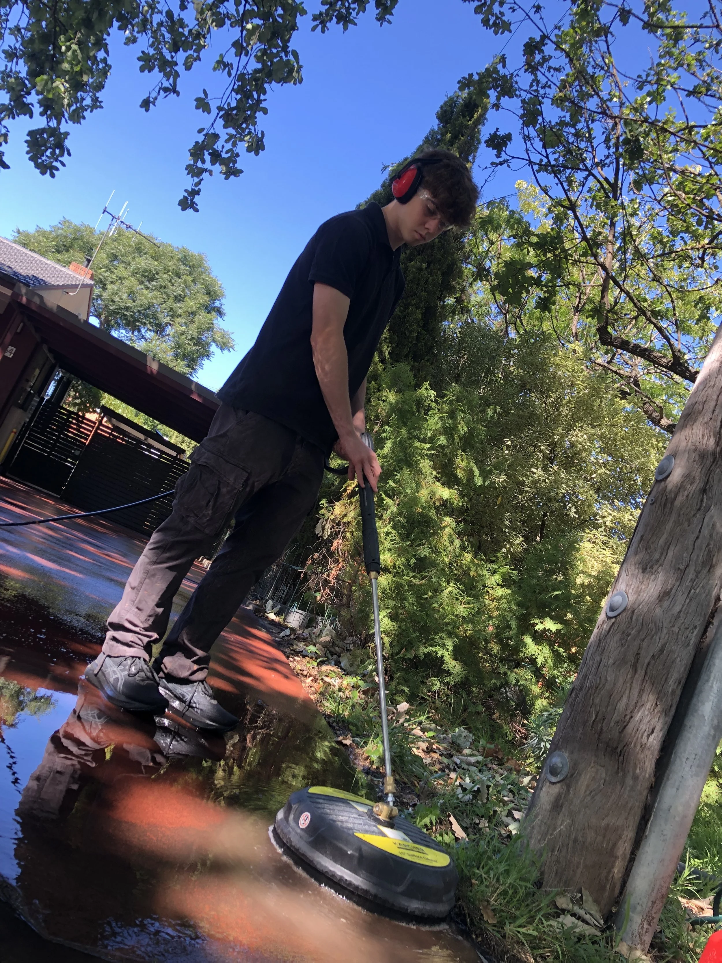 Cleaning driveways in canberra with expert pressure washing tools