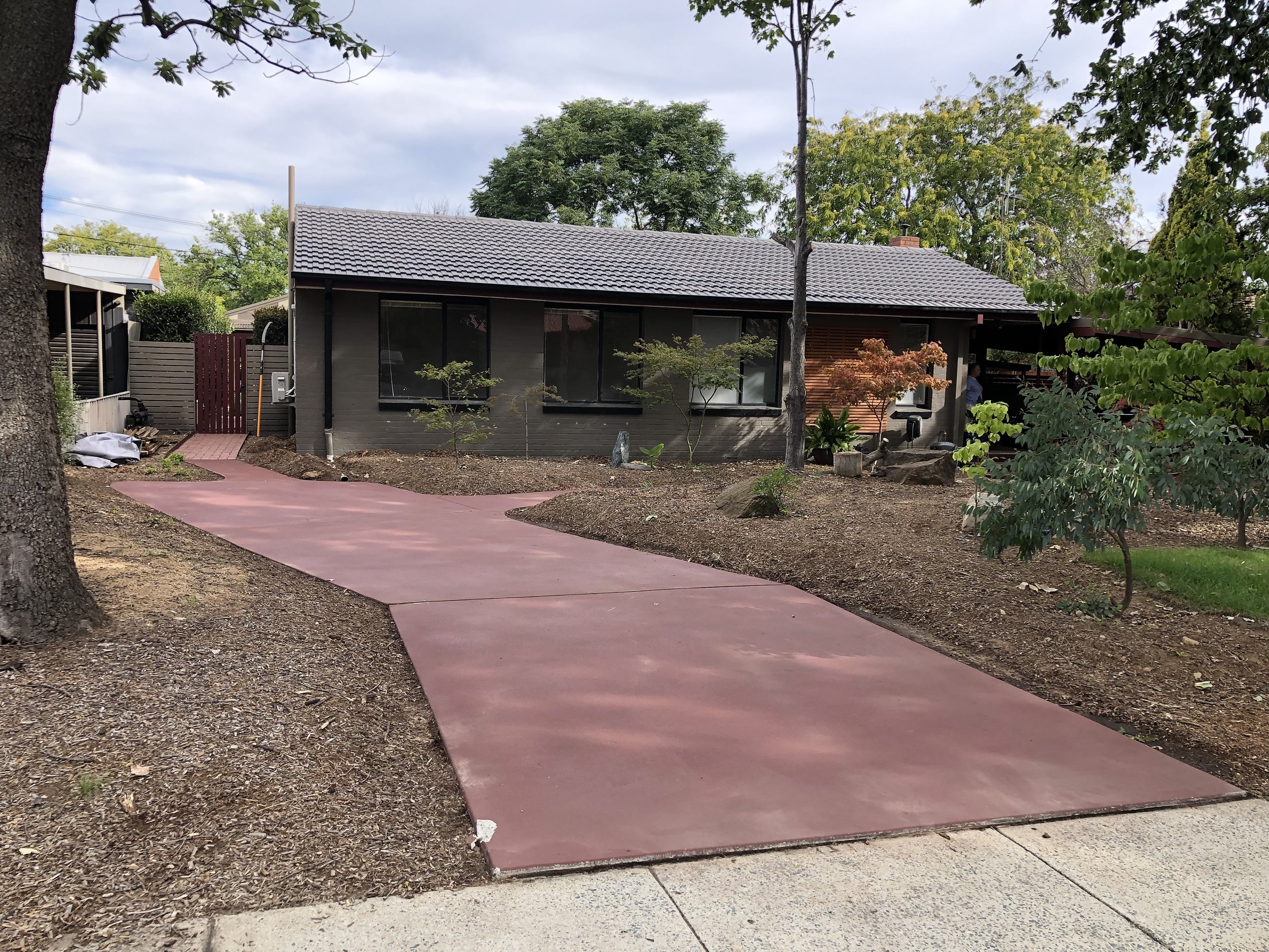 After expert pressure washing in a red hill home, resored driveway to looking great